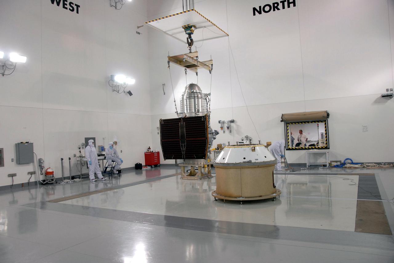 VANDENBERG AIR FORCE BASE, Calif. -- At the Astrotech processing facility on Vandenberg Air Force Base in California, NASA's Wide-field Infrared Survey Explorer, or WISE, is prepared to be lifted by crane from its test stand for mating to its Payload Attach Fitting, at right.    The satellite will survey the entire sky at infrared wavelengths, creating a cosmic clearinghouse of hundreds of millions of objects which will be catalogued and provide a vast storehouse of knowledge about the solar system, the Milky Way, and the universe. Launch is scheduled for Dec. 7.  Photo credit: NASA/Doug Kolkow