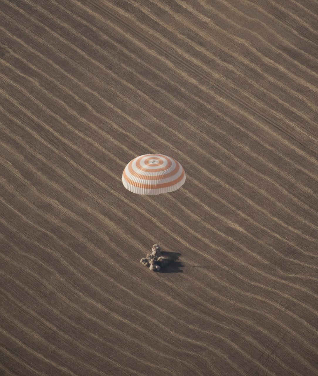 KAZAKHASTAN - The Soyuz TMA-14 spacecraft is seen as it lands with Expedition 20 Commander Gennady Padalka, Flight Engineer Michael Barratt, and spaceflight participant Guy Laliberte near the town of Arkalyk, Kazakhstan, on Sunday, Oct. 11, 2009. Padalka and Barratt are returning from six months onboard the International Space Station, along with Laliberte who arrived at the station on Oct. 2 with Expedition 21 Flight Engineers Jeff Williams and Maxim Suraev aboard the Soyuz TMA-16 spacecraft. Photo Credit: NASA/Bill Ingalls