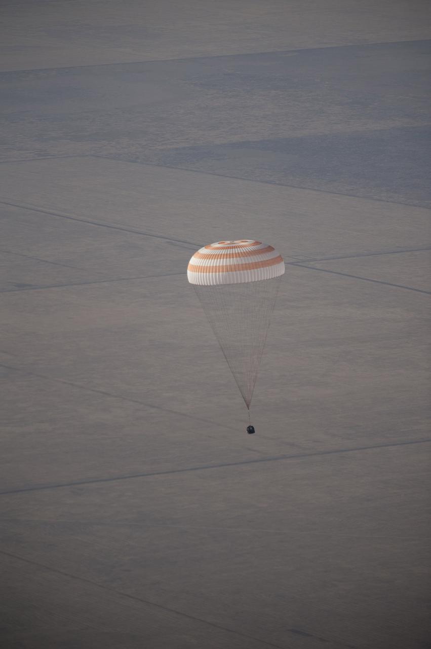 KAZAKHASTAN - The Soyuz TMA-14 spacecraft is seen as it lands with Expedition 20 Commander Gennady Padalka, Flight Engineer Michael Barratt, and spaceflight participant Guy Laliberte near the town of Arkalyk, Kazakhstan, on Sunday, Oct. 11, 2009. Padalka and Barratt are returning from six months onboard the International Space Station, along with Laliberte who arrived at the station on Oct. 2 with Expedition 21 Flight Engineers Jeff Williams and Maxim Suraev aboard the Soyuz TMA-16 spacecraft. Photo Credit: NASA/Bill Ingalls