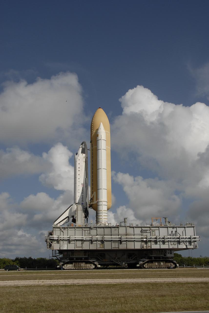 CAPE CANAVERAL, Fla. – At NASA's Kennedy Space Center in Florida, space shuttle Atlantis makes steady progress on its 3.4-mile trek from the Vehicle Assembly Building to Launch Pad 39A. First motion was at 6:38 a.m. EDT Oct. 14. The move, known as rollout, is expected to take about six hours.    Liftoff of Atlantis on its STS-129 mission to the International Space Station is targeted for Nov. 12. For information on the STS-129 mission and crew, visit http://www.nasa.gov/mission_pages/shuttle/shuttlemissions/sts129/index.html. Photo credit: NASA/Kim Shiflett