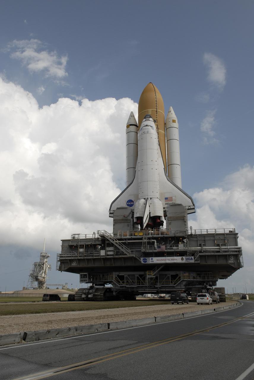 CAPE CANAVERAL, Fla. – At NASA's Kennedy Space Center in Florida, space shuttle Atlantis approaches Launch Pad 39A, at left, on its 3.4-mile trek from the Vehicle Assembly Building. First motion was at 6:38 a.m. EDT Oct. 14. The move, known as rollout, is expected to take about six hours.    Liftoff of Atlantis on its STS-129 mission to the International Space Station is targeted for Nov. 12. For information on the STS-129 mission and crew, visit http://www.nasa.gov/mission_pages/shuttle/shuttlemissions/sts129/index.html. Photo credit: NASA/Kim Shiflett