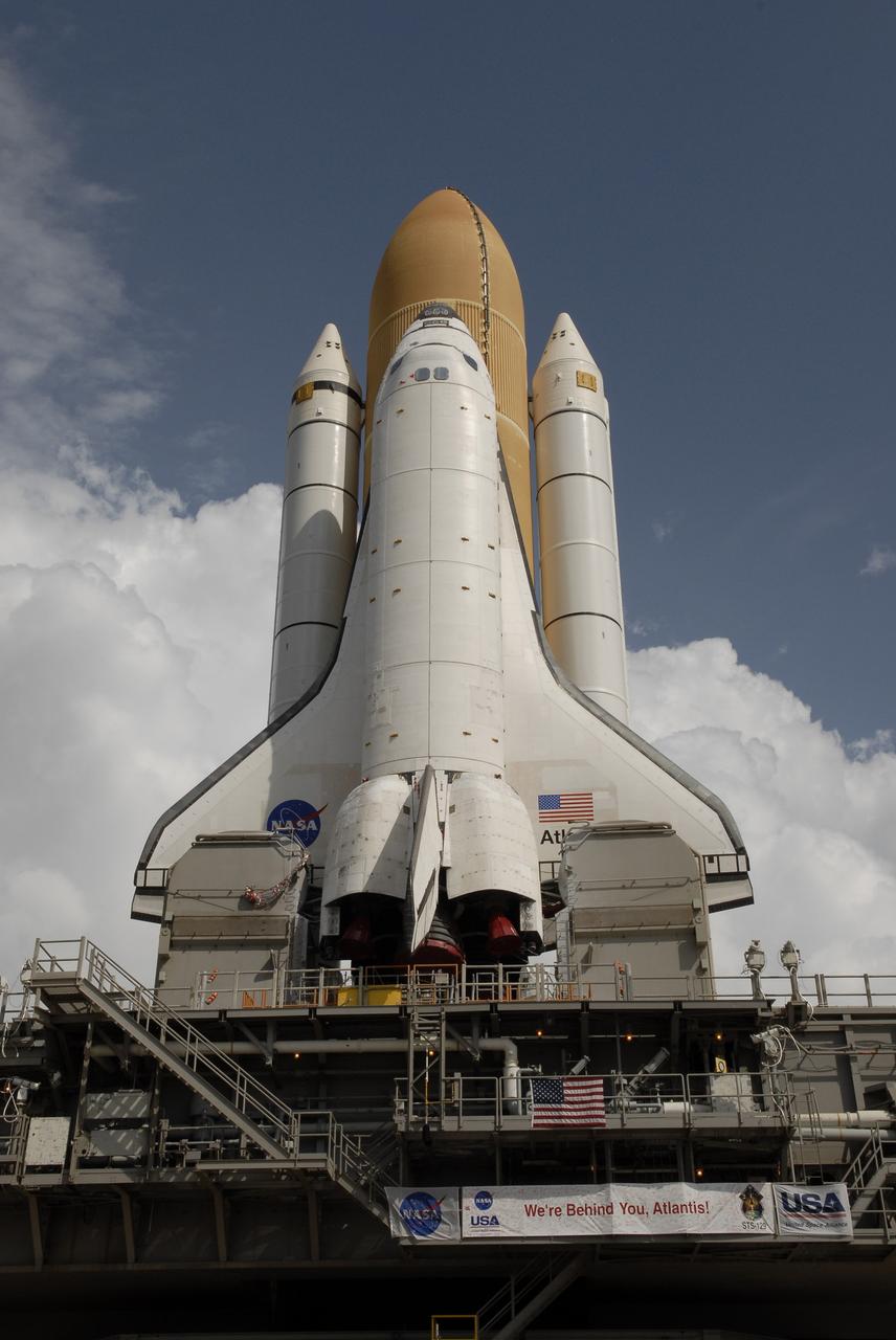 CAPE CANAVERAL, Fla. – At NASA's Kennedy Space Center in Florida, space shuttle Atlantis, attached to its external tank and solid rocket boosters atop a mobile launcher platform, nears the end of its 3.4-mile trip, known as rollout, from the Vehicle Assembly Building to Launch Pad 39A. First motion was at 6:38 a.m. EDT Oct. 14. Rollout is expected to take about six hours.    Liftoff of Atlantis on its STS-129 mission to the International Space Station is targeted for Nov. 12. For information on the STS-129 mission and crew, visit http://www.nasa.gov/mission_pages/shuttle/shuttlemissions/sts129/index.html. Photo credit: NASA/Kim Shiflett