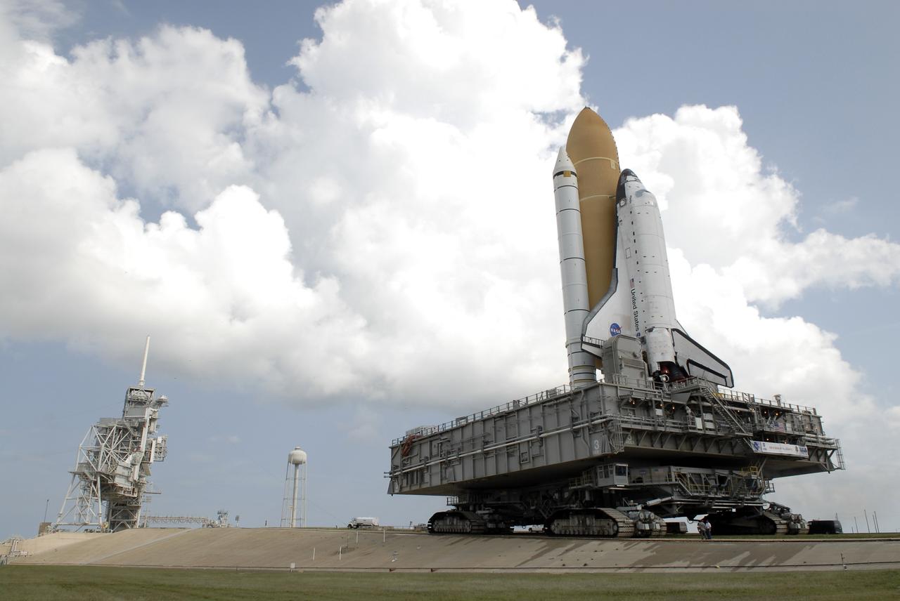 CAPE CANAVERAL, Fla. – At NASA's Kennedy Space Center in Florida, a crawler-transporter keeps space shuttle Atlantis level as it travels up the five percent grade to the top of the crawlerway at Launch Complex 39A. First motion on the 3.4-mile trip from the Vehicle Assembly Building, known as rollout, was at 6:38 a.m. EDT Oct. 14. The rollout took about six hours, and the shuttle was secure on the pad at 1:31 p.m.    Liftoff of Atlantis on its STS-129 mission to the International Space Station is targeted for Nov. 12. For information on the STS-129 mission and crew, visit http://www.nasa.gov/mission_pages/shuttle/shuttlemissions/sts129/index.html. Photo credit: NASA/Kim Shiflett