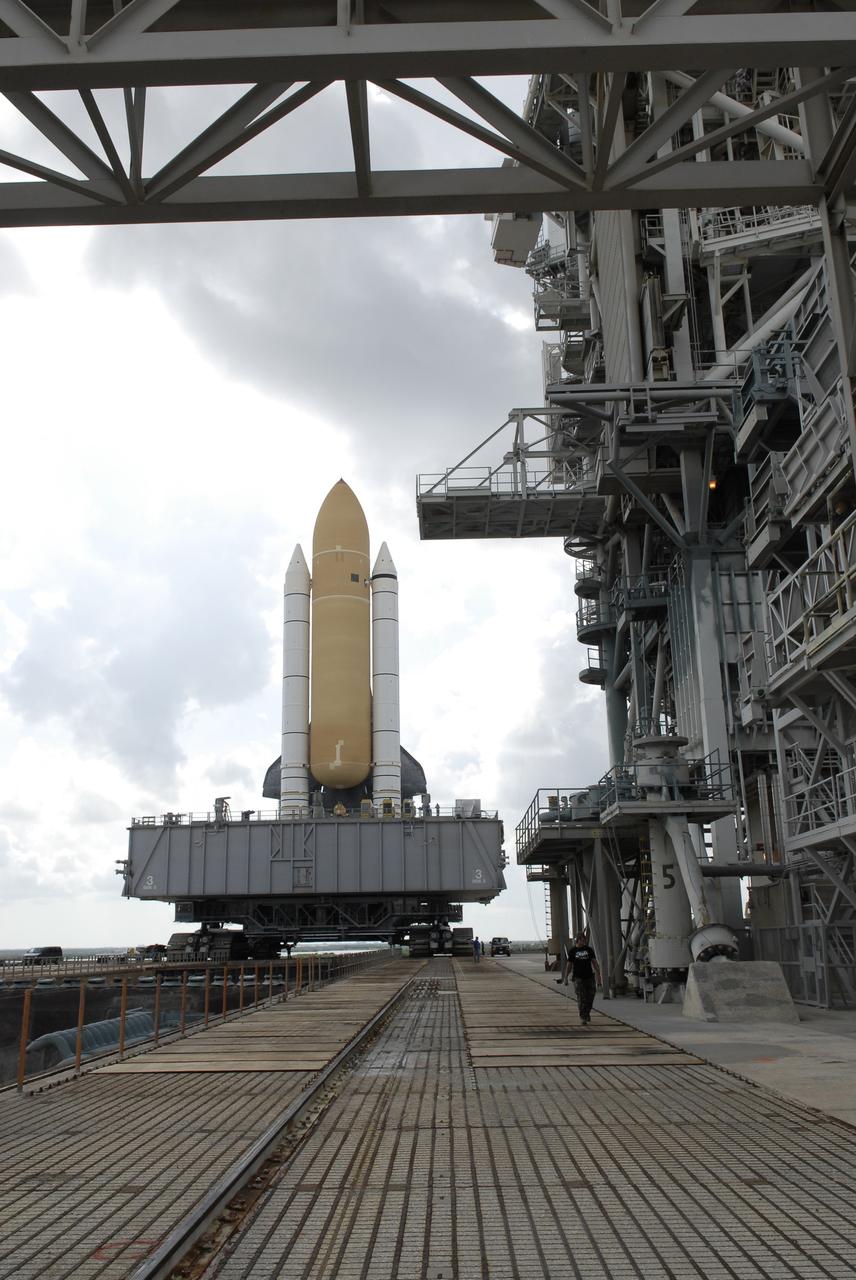 CAPE CANAVERAL, Fla. – At NASA's Kennedy Space Center in Florida, a crawler-transport safely delivers space shuttle Atlantis into position beside the fixed service structure on Launch Pad 39A.  First motion on the 3.4-mile journey from the Vehicle Assembly Building, known as rollout, was at 6:38 a.m. EDT Oct. 14. The rollout took about six hours, and the shuttle was secure on the pad at 1:31 p.m.    Liftoff of Atlantis on its STS-129 mission to the International Space Station is targeted for Nov. 12. For information on the STS-129 mission and crew, visit http://www.nasa.gov/mission_pages/shuttle/shuttlemissions/sts129/index.html. Photo credit: NASA/Kim Shiflett