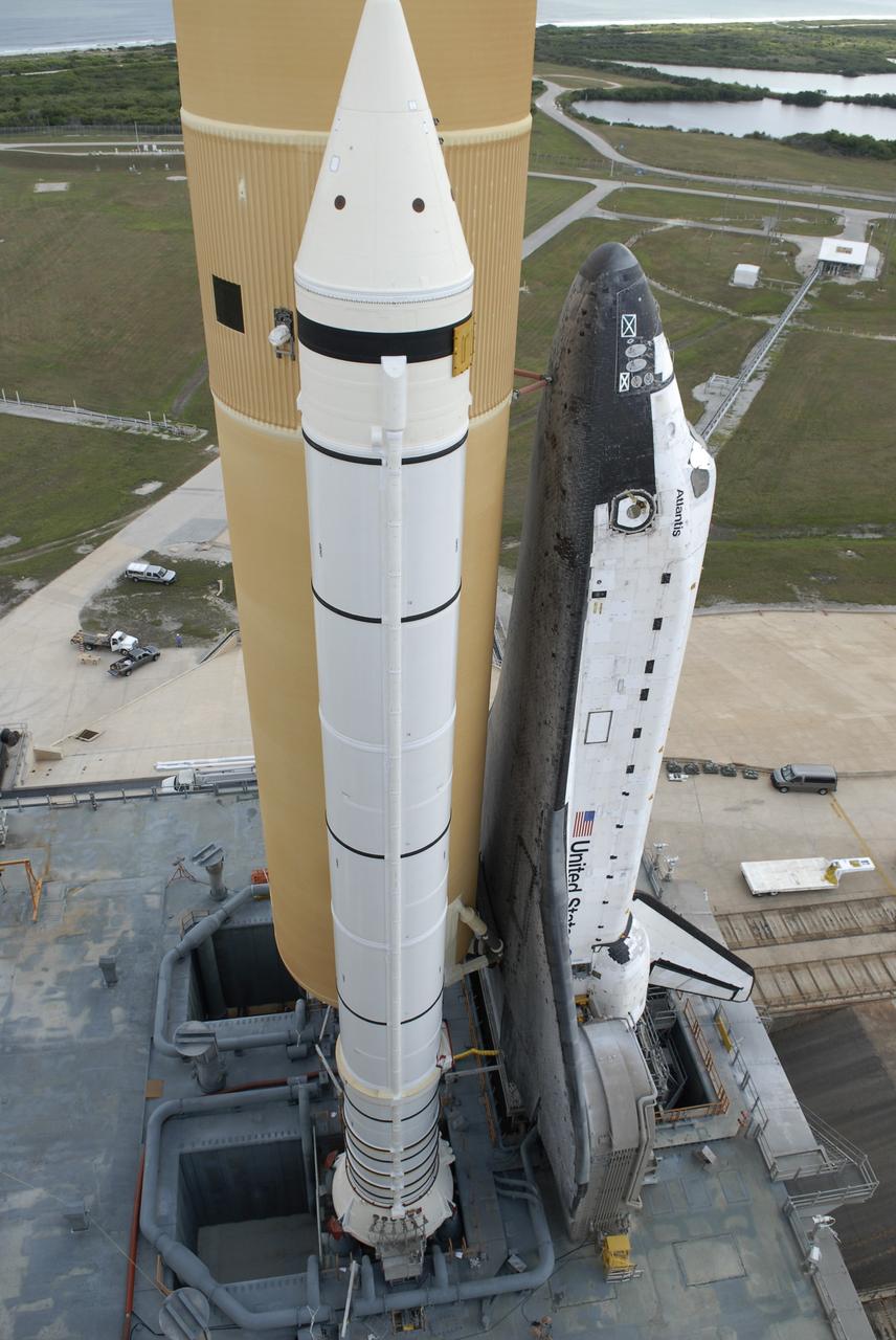 CAPE CANAVERAL, Fla. – At NASA's Kennedy Space Center in Florida, the mobile launcher platform, on which space shuttle Atlantis sits, straddles the flame trench on Launch Pad 39A.  First motion on the 3.4-mile journey from the Vehicle Assembly Building, known as rollout, was at 6:38 a.m. EDT Oct. 14. The rollout took about six hours, and the shuttle was secure or "hard down" on the pad at 1:31 p.m.    Liftoff of Atlantis on its STS-129 mission to the International Space Station is targeted for Nov. 12. For information on the STS-129 mission and crew, visit http://www.nasa.gov/mission_pages/shuttle/shuttlemissions/sts129/index.html. Photo credit: NASA/Kim Shiflett