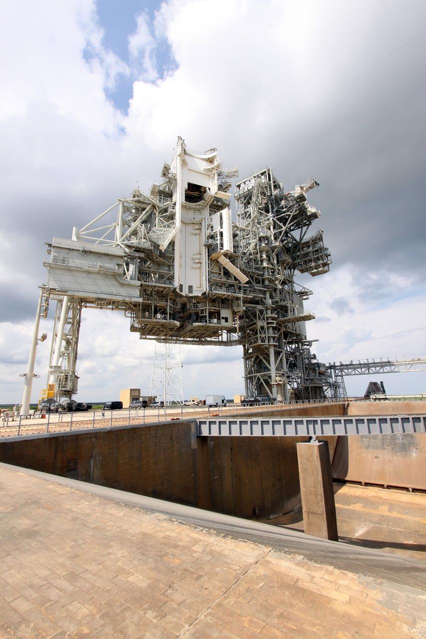 CAPE CANAVERAL, Fla. – At NASA's Kennedy Space Center in Florida, modifications to Launch Pad 39B are complete, and the pad is ready to support the Ares I-X rocket.  The transfer of the pad from the Space Shuttle Program to the Constellation Program took place May 31. Modifications made to the pad include the removal of shuttle unique subsystems, such as the orbiter access arm and a section of the gaseous oxygen vent arm, along with the installation of three 600-foot lightning towers, access platforms, environmental control systems and a vehicle stabilization system.    Part of the Constellation Program, the Ares I-X is the test vehicle for the Ares I, which is the essential core of a space transportation system designed to carry crewed missions back to the moon, on to Mars and out into the solar system. The Ares I-X flight test is targeted for Oct. 27. For information on the Ares I-X vehicle and flight test, visit http://www.nasa.gov/aresIX. Photo credit: NASA/Jack Pfaller