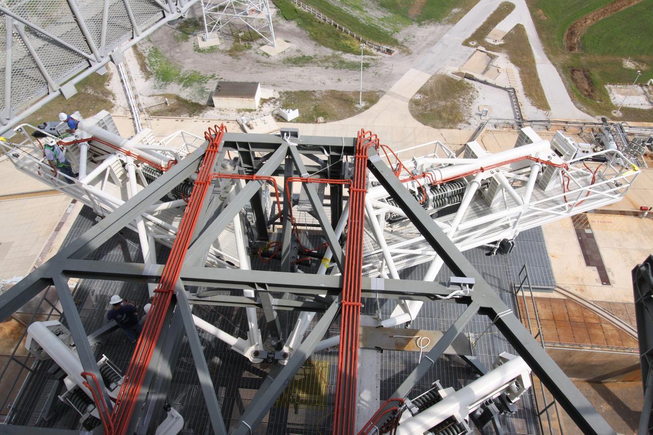 CAPE CANAVERAL, Fla. – At NASA's Kennedy Space Center in Florida, a vehicle stabilization system has been installed on the 235-foot level of Launch Pad 39B to support the Ares I-X rocket.  The transfer of the pad from the Space Shuttle Program to the Constellation Program took place May 31.  Other modifications made to the pad include the removal of shuttle unique subsystems, such as the orbiter access arm and a section of the gaseous oxygen vent arm, along with the installation of three 600-foot lightning towers, access platforms and environmental control systems.    Part of the Constellation Program, the Ares I-X is the test vehicle for the Ares I, which is the essential core of a space transportation system designed to carry crewed missions back to the moon, on to Mars and out into the solar system. The Ares I-X flight test is targeted for Oct. 27. For information on the Ares I-X vehicle and flight test, visit http://www.nasa.gov/aresIX. Photo credit: NASA/Jack Pfaller