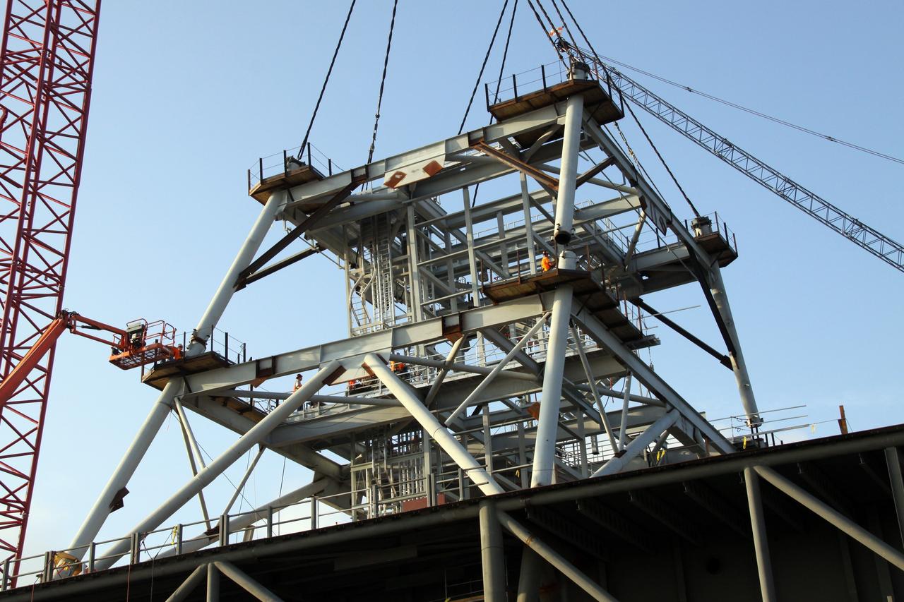 CAPE CANAVERAL, Fla. – At NASA's Kennedy Space Center in Florida, the second section of a tower for a new mobile launcher, or ML, for the Constellation Program is secured to the first. Installation of the first section was on Sept. 24. The tower will have multiple platforms for personnel access and be approximately 345 feet tall. The launcher is being built at the mobile launcher park site area located north of Kennedy's Vehicle Assembly Building to support the Ares I rocket. The ML will provide a base to launch the Ares I which will transport the Orion crew exploration vehicle, its crew and cargo to low Earth orbit. The base is being made lighter than space shuttle mobile launcher platforms so the crawler-transporter can pick up the heavier load of the tower and taller rocket. For information on the Ares I, visit http://www.nasa.gov/ares. Photo credit: NASA/Jack Pfaller