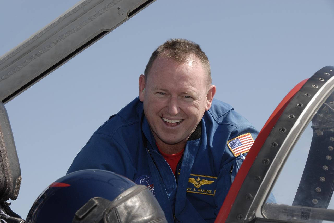 CAPE CANAVERAL, Fla. - STS-129 Pilot Barry E. Wilmore greets the camera with a smile as he disembarks from a T-38 at the Shuttle Landing Facility at NASA's Kennedy Space Center in Florida.  The crew members of space shuttle Atlantis' STS-129 mission have arrived at Kennedy for training related to their launch dress rehearsal, the Terminal Countdown Demonstration Test.    Launch of Atlantis on its STS-129 mission to the International Space Station is targeted for November. For information on the STS-129 mission objectives and crew, visit http://www.nasa.gov/mission_pages/shuttle/shuttlemissions/sts129/index.html. Photo credit: NASA/Kim Shiflett