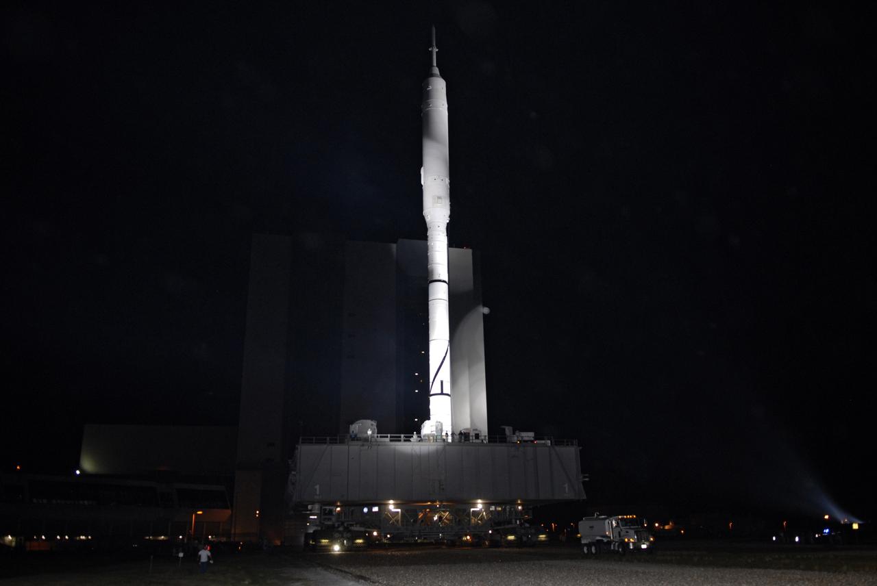 CAPE CANAVERAL, Fla. - The Ares I-X rocket heads toward Launch Pad 39B at NASA's Kennedy Space Center in Florida, riding atop a crawler-transporter. The 4.2-mile trip to the pad from the massive Vehicle Assembly Building began at 1:39 a.m. EDT.    The transfer of the pad from the Space Shuttle Program to the Constellation Program took place May 31. Modifications made to the pad include the removal of shuttle unique subsystems, such as the orbiter access arm and a section of the gaseous oxygen vent arm, along with the installation of three 600-foot lightning towers, access platforms, environmental control systems and a vehicle stabilization system.  Part of the Constellation Program, the Ares I-X is the test vehicle for the Ares I. The Ares I-X flight test is targeted for Oct. 27. For information on the Ares I-X vehicle and flight test, visit http://www.nasa.gov/aresIX. Photo credit: NASA/Kim Shiflett