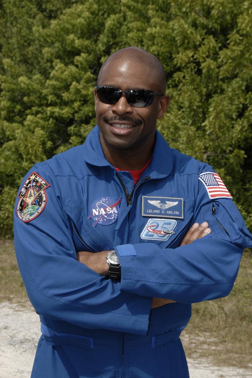 CAPE CANAVERAL, Fla. - At NASA's Kennedy Space Center in Florida, STS-129 Mission Specialist Leland Melvin prepares to practice driving an M113 armored personnel carrier.    The M113 is kept at the foot of the launch pad in case an emergency egress from the vicinity of the pad is needed.  The crew members of space shuttle Atlantis' STS-129 mission are at Kennedy for training related to their launch dress rehearsal, the Terminal Countdown Demonstration Test.  Launch of Atlantis on its STS-129 mission to the International Space Station is targeted for Nov. 16. For information on the STS-129 mission objectives and crew, visit http://www.nasa.gov/mission_pages/shuttle/shuttlemissions/sts129/index.html. Photo credit: NASA/Kim Shiflett