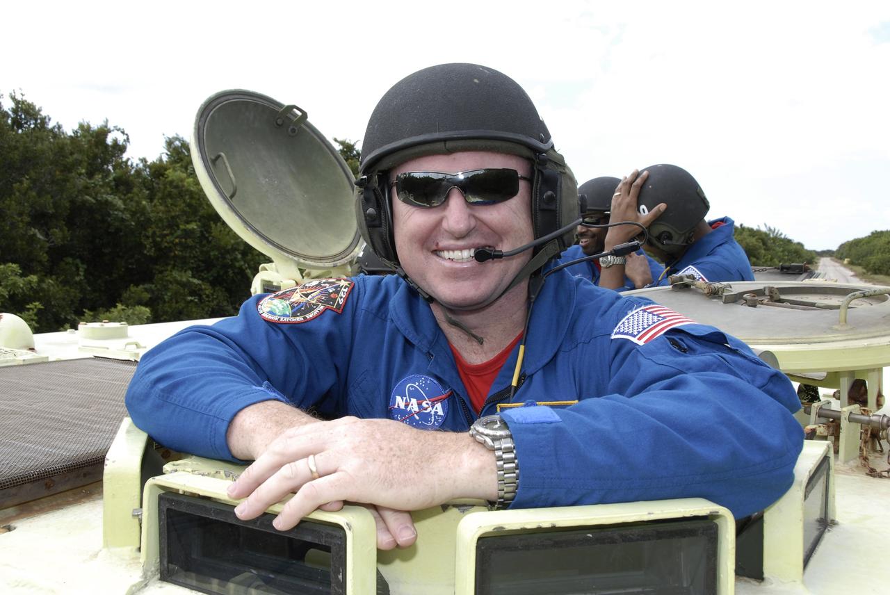 CAPE CANAVERAL, Fla. - At NASA's Kennedy Space Center in Florida, STS-129 Pilot Barry E. Wilmore prepares to drive an M113 armored personnel carrier.    The M113 is kept at the foot of the launch pad in case an emergency egress from the vicinity of the pad is needed.  The crew members of space shuttle Atlantis' STS-129 mission are at Kennedy for training related to their launch dress rehearsal, the Terminal Countdown Demonstration Test.  Launch of Atlantis on its STS-129 mission to the International Space Station is targeted for Nov. 16. For information on the STS-129 mission objectives and crew, visit http://www.nasa.gov/mission_pages/shuttle/shuttlemissions/sts129/index.html. Photo credit: NASA/Kim Shiflett