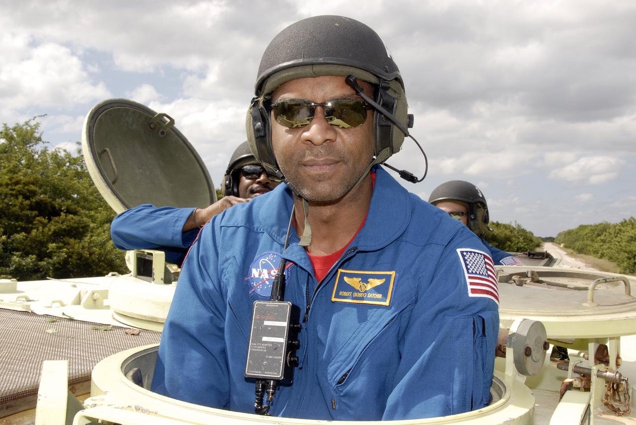 CAPE CANAVERAL, Fla. - At NASA's Kennedy Space Center in Florida, STS-129 Mission Specialist Robert L. Satcher Jr. prepares to drive an M113 armored personnel carrier.    The M113 is kept at the foot of the launch pad in case an emergency egress from the vicinity of the pad is needed.  The crew members of space shuttle Atlantis' STS-129 mission are at Kennedy for training related to their launch dress rehearsal, the Terminal Countdown Demonstration Test.  Launch of Atlantis on its STS-129 mission to the International Space Station is targeted for Nov. 16. For information on the STS-129 mission objectives and crew, visit http://www.nasa.gov/mission_pages/shuttle/shuttlemissions/sts129/index.html. Photo credit: NASA/Kim Shiflett