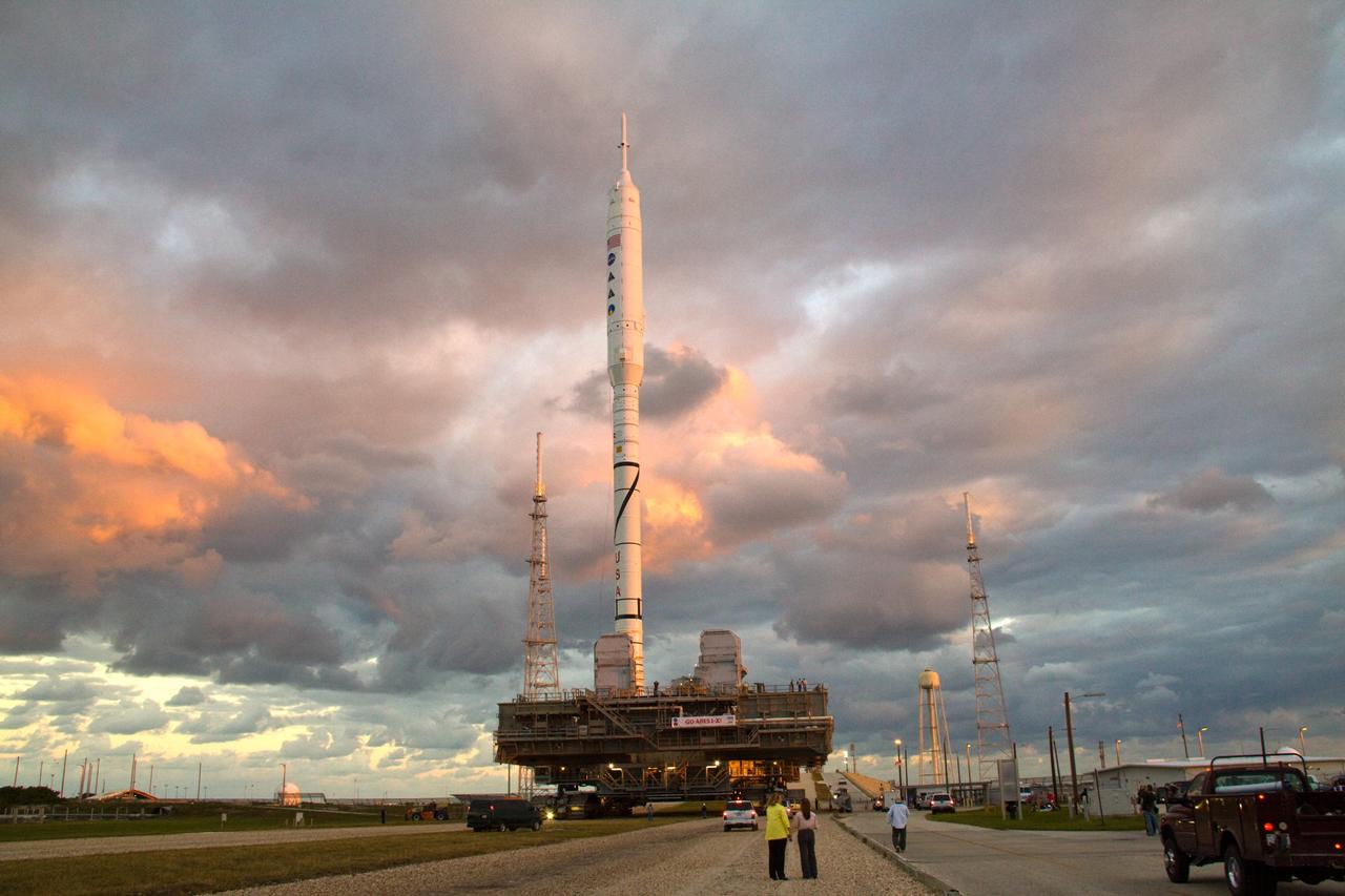 CAPE CANAVERAL, Fla. – As the sun rises over Launch Pad 39B at NASA's Kennedy Space Center in Florida, the 327-foot-tall Ares I-X rocket, secured to a mobile launcher platform, prepares to climb the five percent grade of the crawlerway to the top of the pad. The test rocket left the Vehicle Assembly Building at 1:39 a.m. EDT on its 4.2-mile trek to the pad and was "hard down" on the pad’s pedestals at 9:17 a.m. The transfer of the pad from the Space Shuttle Program to the Constellation Program took place May 31. Modifications made to the pad include the removal of shuttle unique subsystems, such as the orbiter access arm and a section of the gaseous oxygen vent arm, along with the installation of three 600-foot lightning towers, access platforms, environmental control systems and a vehicle stabilization system. Part of the Constellation Program, the Ares I-X is the test vehicle for the Ares I. The Ares I-X flight test is targeted for Oct. 27. For information on the Ares I-X vehicle and flight test, visit http://www.nasa.gov/aresIX. Photo credit: NASA/Jack Pfaller