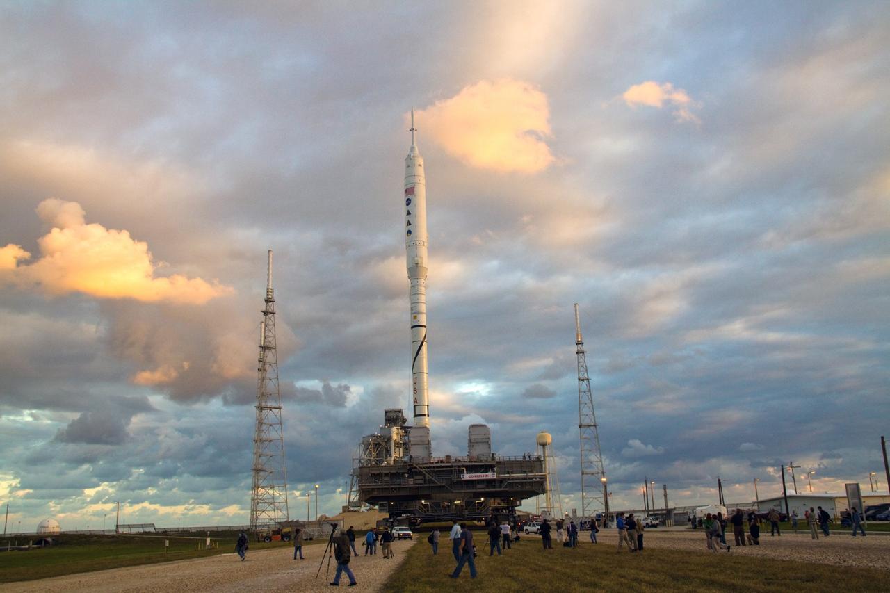 CAPE CANAVERAL, Fla. – Sunrise over NASA's Kennedy Space Center in Florida reveals the 327-foot-tall Ares I-X rocket, secured to a mobile launcher platform, nearing its destination on Launch Pad 39B. The test rocket left the Vehicle Assembly Building at 1:39 a.m. EDT on its 4.2-mile trek to the pad and was "hard down" on the pad’s pedestals at 9:17 a.m. The transfer of the pad from the Space Shuttle Program to the Constellation Program took place May 31. Modifications made to the pad include the removal of shuttle unique subsystems, such as the orbiter access arm and a section of the gaseous oxygen vent arm, along with the installation of three 600-foot lightning towers, access platforms, environmental control systems and a vehicle stabilization system. Part of the Constellation Program, the Ares I-X is the test vehicle for the Ares I. The Ares I-X flight test is targeted for Oct. 27. For information on the Ares I-X vehicle and flight test, visit http://www.nasa.gov/aresIX. Photo credit: NASA/Jack Pfaller