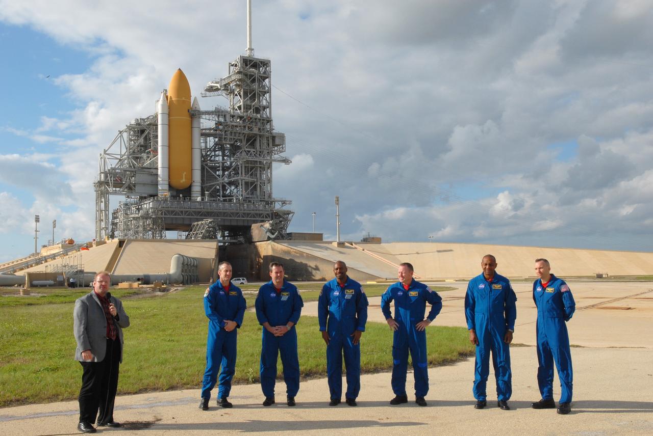CAPE CANAVERAL, Fla. - At Launch Pad 39A at NASA's Kennedy Space Center in Florida, members of space shuttle Atlantis' STS-129 crew are prepared to answer questions from the media. From left are Kennedy's News Chief Allard Beutel, at microphone; Commander Charles O. Hobaugh; Mission Specialists Mike Foreman and Leland Melvin; Pilot Barry E. Wilmore; and Mission Specialists Robert L. Satcher Jr. and Randy Bresnik.    The crew members of space shuttle Atlantis' STS-129 mission are at Kennedy for training related to their launch dress rehearsal, the Terminal Countdown Demonstration Test.  Launch of Atlantis on its STS-129 mission to the International Space Station is targeted for Nov. 16. For information on the STS-129 mission objectives and crew, visit http://www.nasa.gov/mission_pages/shuttle/shuttlemissions/sts129/index.html. Photo credit: NASA/Kim Shiflett