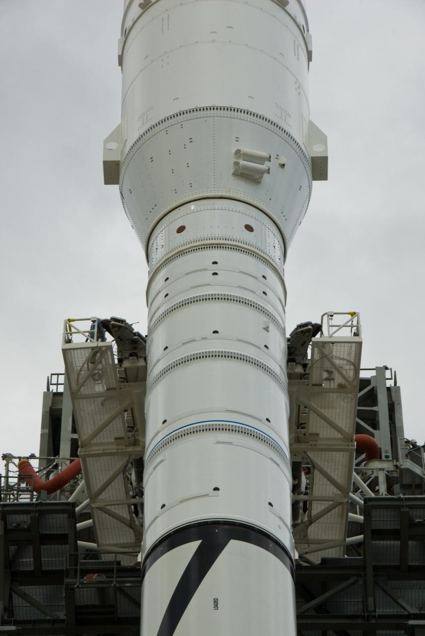 CAPE CANAVERAL, Fla. – The arms of the vehicle stabilization system are closed around the towering 327-foot-tall Ares I-X rocket, newly arrived on Launch Pad 39B at NASA's Kennedy Space Center in Florida.    The test rocket left the Vehicle Assembly Building at 1:39 a.m. EDT on its 4.2-mile trek to the pad and was "hard down" on the pad’s pedestals at 9:17 a.m.  The transfer of the pad from the Space Shuttle Program to the Constellation Program took place May 31. Modifications made to the pad include the removal of shuttle unique subsystems, such as the orbiter access arm and a section of the gaseous oxygen vent arm, along with the installation of three 600-foot lightning towers, access platforms, environmental control systems and a vehicle stabilization system.  Part of the Constellation Program, the Ares I-X is the test vehicle for the Ares I. The Ares I-X flight test is targeted for Oct. 27. For information on the Ares I-X vehicle and flight test, visit http://www.nasa.gov/aresIX.  Photo credit: NASA/Kim Shiflett