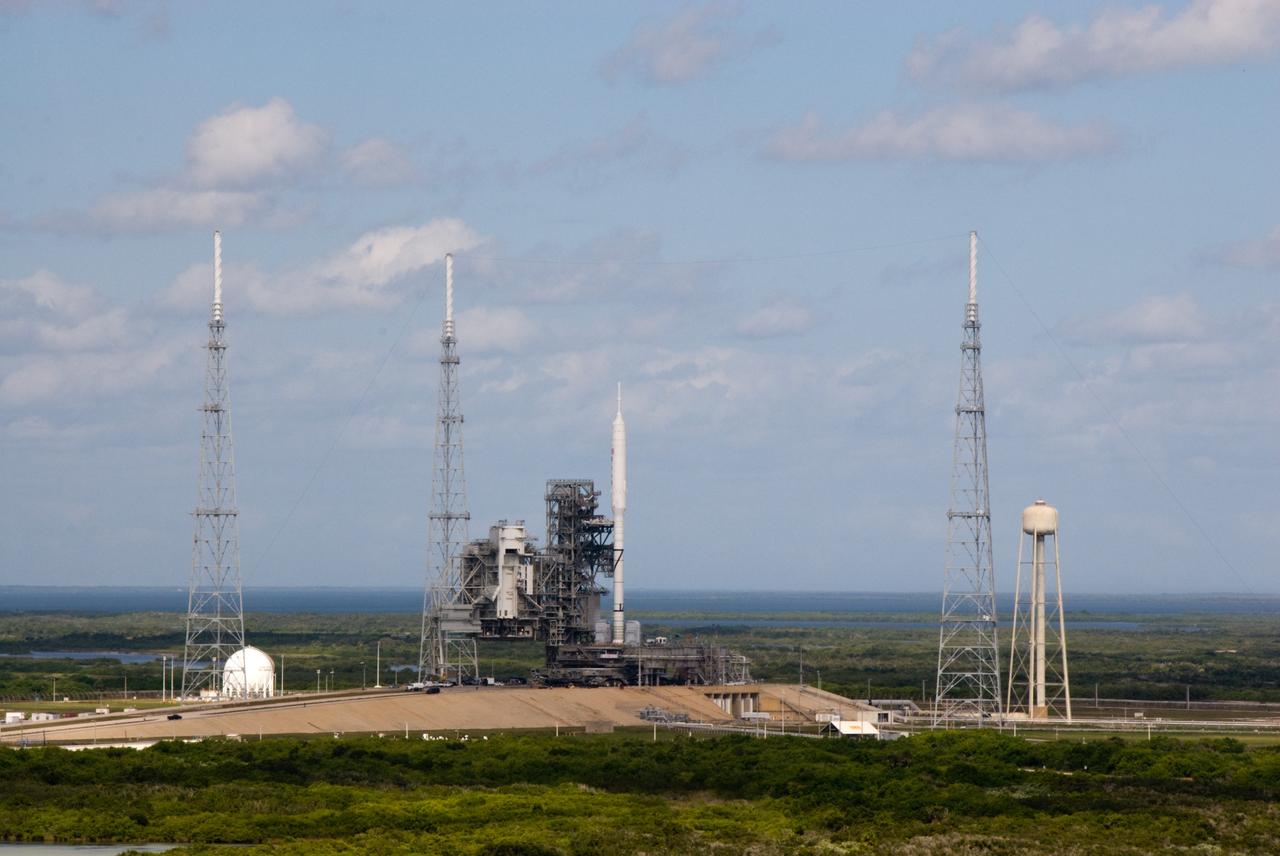 CAPE CANAVERAL, Fla. - The Ares I-X rocket on Launch Pad 39B at NASA's Kennedy Space Center in Florida is ready for final processing for its upcoming flight test. The test rocket left the Vehicle Assembly Building at 1:39 a.m. EDT on its 4.2-mile trek to the pad and was "hard down" on the pad’s pedestals at 9:17 a.m. The transfer of the pad from the Space Shuttle Program to the Constellation Program took place May 31. Modifications made to the pad include the removal of shuttle unique subsystems, such as the orbiter access arm and a section of the gaseous oxygen vent arm, along with the installation of three 600-foot lightning towers, access platforms, environmental control systems and a vehicle stabilization system. Part of the Constellation Program, the Ares I-X is the test vehicle for the Ares I. The Ares I-X flight test is targeted for Oct. 27. For information on the Ares I-X vehicle and flight test, visit http://www.nasa.gov/aresIX. Photo credit: NASA/Kim Shiflett