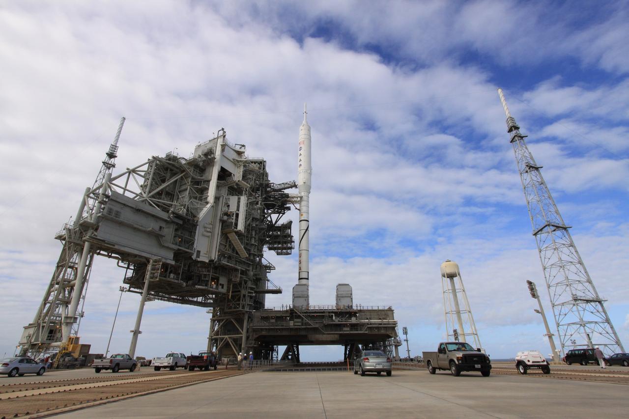 CAPE CANAVERAL, Fla. – The 327-foot-tall Ares I-X rocket is not the tallest structure on Launch Pad 39B at NASA's Kennedy Space Center in Florida. On either side of the pad are 100-foot fiberglass lightning masts mounted atop 500-foot towers. The rotating service structure, or RSS, was retracted from the rocket at midday. A full test of the rocket will be conducted, including a "hot fire" of the auxiliary power units as part of the integrated systems test. The transfer of the pad from the Space Shuttle Program to the Constellation Program took place May 31. Modifications made to the pad include the removal of shuttle unique subsystems, such as the orbiter access arm and a section of the gaseous oxygen vent arm, along with the installation of three 600-foot lightning towers, access platforms, environmental control systems and a vehicle stabilization system. Part of the Constellation Program, the Ares I-X is the test vehicle for the Ares I. The Ares I-X flight test is targeted for Oct. 27. For information on the Ares I-X vehicle and flight test, visit http://www.nasa.gov/aresIX. Photo credit: NASA/Jack Pfaller