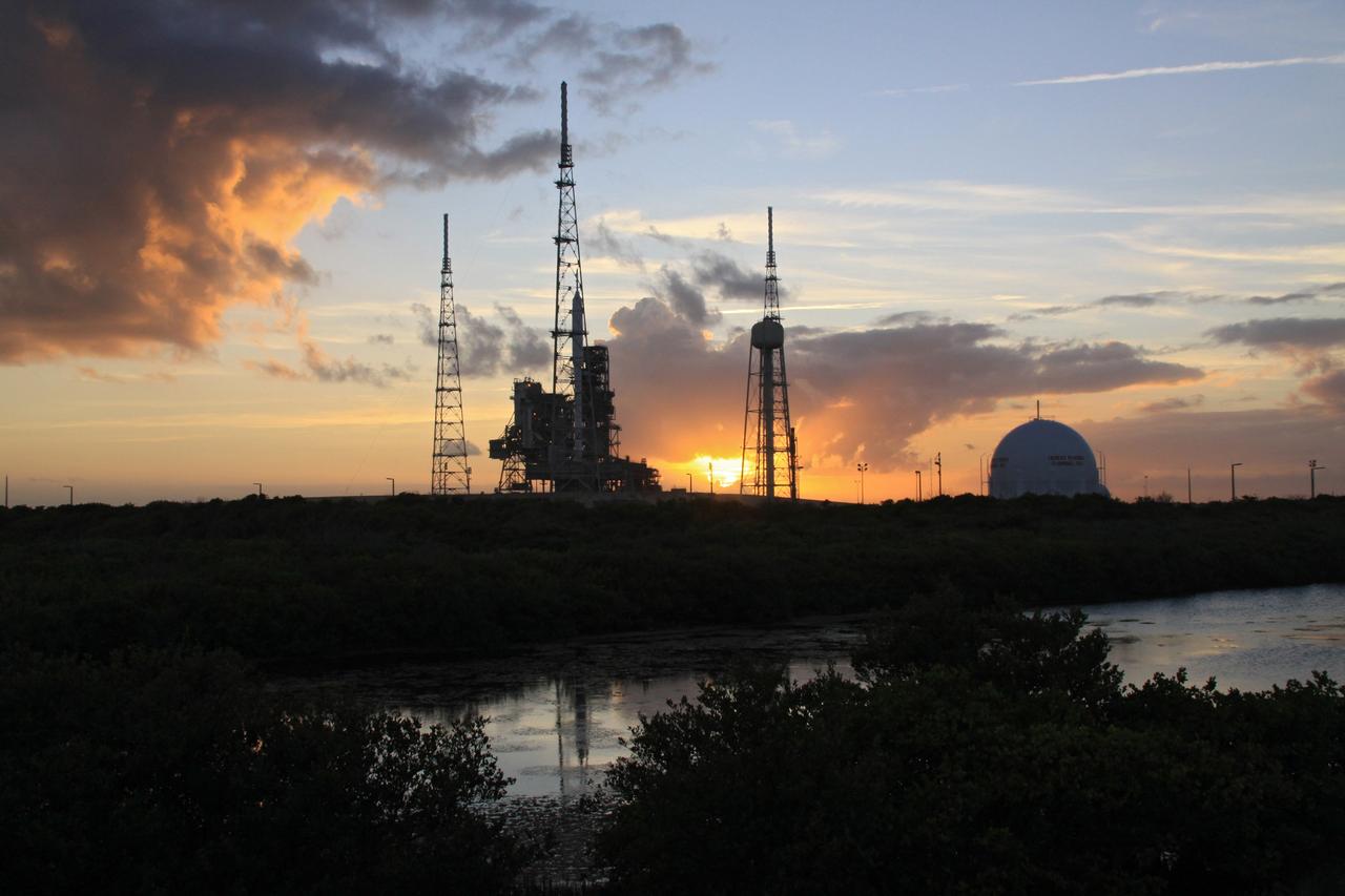 CAPE CANAVERAL, Fla. – At sunset at Launch Pad 39B at NASA's Kennedy Space Center in Florida, the rotating service structure, or RSS, has been retracted from the 327-foot-tall Ares I-X rocket to allow a full test of the rocket to be conducted.    The transfer of the pad from the Space Shuttle Program to the Constellation Program took place May 31. Modifications made to the pad include the removal of shuttle unique subsystems, such as the orbiter access arm and a section of the gaseous oxygen vent arm, along with the installation of three 600-foot lightning towers, access platforms, environmental control systems and a vehicle stabilization system.  Part of the Constellation Program, the Ares I-X is the test vehicle for the Ares I. The Ares I-X flight test is targeted for Oct. 27. For information on the Ares I-X vehicle and flight test, visit http://www.nasa.gov/aresIX. Photo credit: NASA/Jack Pfaller