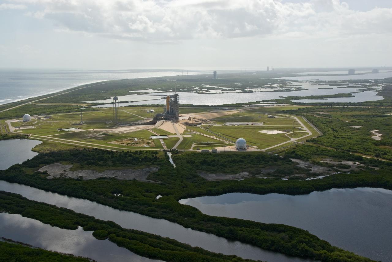 CAPE CANAVERAL, Fla. – At NASA's Kennedy Space Center in Florida, space shuttle Atlantis is poised for liftoff on Launch Pad 39A.  In the distance are the pads and processing facilities on Cape Canaveral Air Force Station.  Liftoff of Atlantis on its STS-129 mission to the International Space Station is targeted for Nov. 16. For information on the STS-129 mission and crew, visit http://www.nasa.gov/mission_pages/shuttle/shuttlemissions/sts129/index.html.    Photo credit: NASA/Kim Shiflett