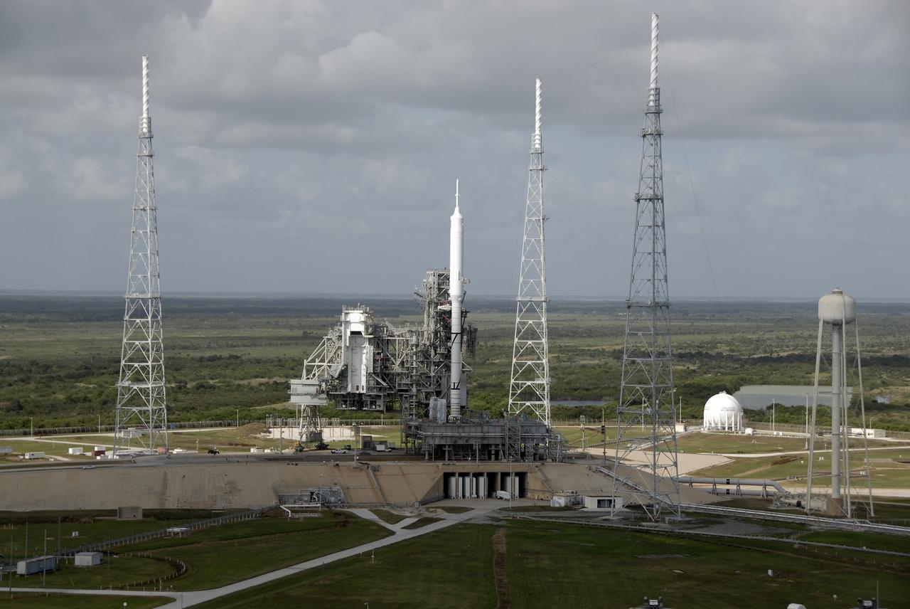 CAPE CANAVERAL, Fla. – At NASA's Kennedy Space Center in Florida, the 327-foot-tall Ares I-X rocket is the first vehicle processed on Launch Pad 39B other than the space shuttle since the Apollo Program's Saturn rockets were retired. The transfer of the pad from the Space Shuttle Program to the Constellation Program took place May 31. Pad modifications to support the Ares I-X include the removal of shuttle unique subsystems, such as the orbiter access arm and a section of the gaseous oxygen vent arm, and the installation of three 600-foot lightning towers, access platforms, environmental control systems and a vehicle stabilization system.  Part of the Constellation Program, the Ares I-X is the test vehicle for the Ares I.  The Ares I-X flight test is set for Oct. 27.  For information on the Ares I-X vehicle and flight test, visit http://www.nasa.gov/aresIX.    Photo credit: NASA/Kim Shiflett