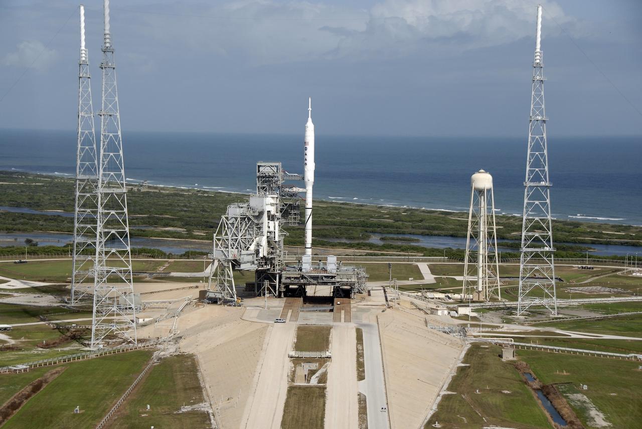 CAPE CANAVERAL, Fla. - Waves break along the Atlantic shoreline near Launch Pad 39B at NASA's Kennedy Space Center in Florida.  On the pad, the Ares I-X rocket awaits liftoff on its upcoming flight test. This is the first time since the Apollo Program's Saturn rockets were retired that a vehicle other than the space shuttle has occupied the pad.  Modifications to the pad to support the Ares I-X included the removal of shuttle unique subsystems, such as the orbiter access arm and a section of the gaseous oxygen vent arm, and the installation of three 600-foot lightning towers, access platforms, environmental control systems and a vehicle stabilization system.  Part of the Constellation Program, the Ares I-X is the test vehicle for the Ares I.  The Ares I-X flight test is set for Oct. 27.  For information on the Ares I-X vehicle and flight test, visit http://www.nasa.gov/aresIX.    Photo credit: NASA/Kim Shiflett