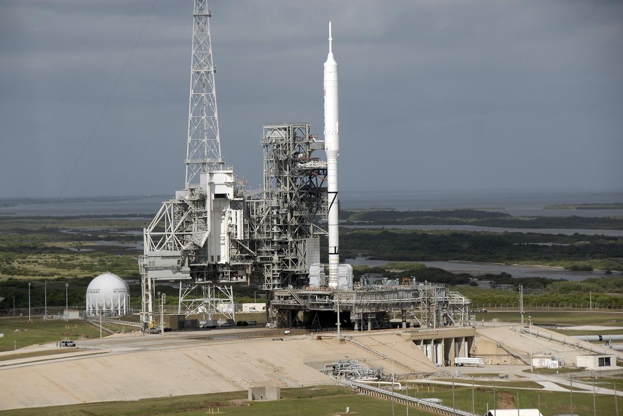 CAPE CANAVERAL, Fla. - At Launch Pad 39B at NASA's Kennedy Space Center in Florida, the Ares I-X rocket, secured to its mobile launcher platform, awaits liftoff on its upcoming flight test. This is the first time since the Apollo Program's Saturn rockets were retired that a vehicle other than the space shuttle has occupied the pad.  Modifications to the pad to support the Ares I-X included the removal of shuttle unique subsystems, such as the orbiter access arm and a section of the gaseous oxygen vent arm, and the installation of three 600-foot lightning towers, access platforms, environmental control systems and a vehicle stabilization system.  Part of the Constellation Program, the Ares I-X is the test vehicle for the Ares I.  The Ares I-X flight test is set for Oct. 27.  For information on the Ares I-X vehicle and flight test, visit http://www.nasa.gov/aresIX.    Photo credit: NASA/Kim Shiflett