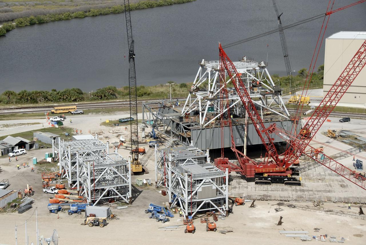 CAPE CANAVERAL, Fla. – At NASA's Kennedy Space Center in Florida, the second section of a tower for a new mobile launcher, or ML, for the Constellation Program has been secured to the first. The launcher is being built at the mobile launcher park site area, located north of Kennedy's Vehicle Assembly Building, to support the Ares I rocket. Installation of the first section was on Sept. 24. The tower will have multiple platforms for personnel access and be approximately 345 feet tall. The ML will provide a base to launch the Ares I which will transport the Orion crew exploration vehicle, its crew and cargo to low Earth orbit. The base is being made lighter than space shuttle mobile launcher platforms so the crawler-transporter can pick up the heavier load of the tower and taller rocket. For information on the Ares I, visit http://www.nasa.gov/ares. Photo credit: NASA/Kim Shiflett