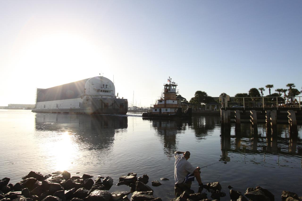 CAPE CANAVERAL, Fla. – At Port Canaveral, a tugboat relieves the Liberty Star for the move of the Pegasus barge, carrying external tank 134, through the Banana River toward the turn basin near the Vehicle Assembly Building, or VAB, at NASA's Kennedy Space Center in Florida. Pegasus arrived in Florida after an ocean voyage towed by the solid rocket booster retrieval ship from NASA's Michoud Assembly Facility near New Orleans. After Pegasus docks in the turn basin, the fuel tank will be offloaded and transported into the VAB. ET-134 will be used to launch space shuttle Endeavour on the STS-130 mission to the International Space Station. Launch is targeted for Feb. 4, 2010. For information on the components of the space shuttle and the STS-130 mission, visit http://www.nasa.gov/shuttle. Photo credit: NASA/Jack Pfaller