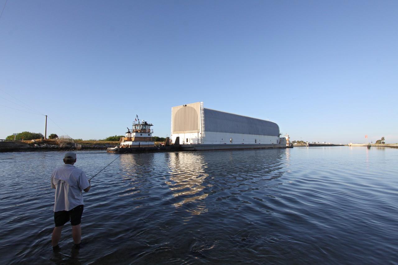 CAPE CANAVERAL, Fla. – At Port Canaveral, a tugboat begins to push the Pegasus barge, carrying external tank 134, through the Banana River toward the turn basin near the Vehicle Assembly Building, or VAB, at NASA's Kennedy Space Center in Florida. Pegasus arrived in Florida after an ocean voyage towed by a solid rocket booster retrieval ship from NASA's Michoud Assembly Facility near New Orleans. After Pegasus docks in the turn basin, the fuel tank will be offloaded and transported into the VAB. ET-134 will be used to launch space shuttle Endeavour on the STS-130 mission to the International Space Station. Launch is targeted for Feb. 4, 2010. For information on the components of the space shuttle and the STS-130 mission, visit http://www.nasa.gov/shuttle. Photo credit: NASA/Jack Pfaller