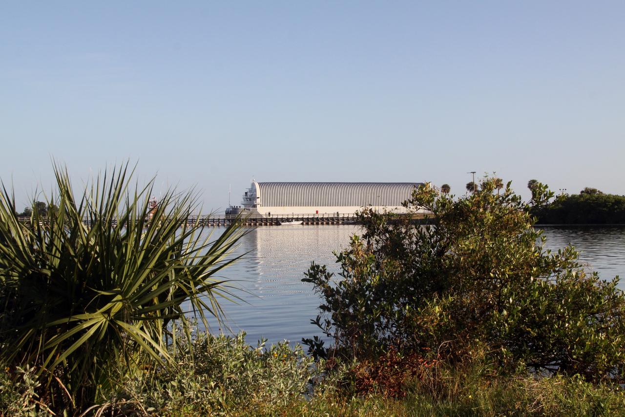CAPE CANAVERAL, Fla. – At Port Canaveral, a tugboat begins to move the Pegasus barge, carrying external tank 134, through the Banana River toward the turn basin near the Vehicle Assembly Building, or VAB, at NASA's Kennedy Space Center in Florida. Pegasus arrived in Florida after an ocean voyage towed by a solid rocket booster retrieval ship from NASA's Michoud Assembly Facility near New Orleans. After Pegasus docks in the turn basin, the fuel tank will be offloaded and transported into the VAB. ET-134 will be used to launch space shuttle Endeavour on the STS-130 mission to the International Space Station. Launch is targeted for Feb. 4, 2010. For information on the components of the space shuttle and the STS-130 mission, visit http://www.nasa.gov/shuttle. Photo credit: NASA/Jack Pfaller