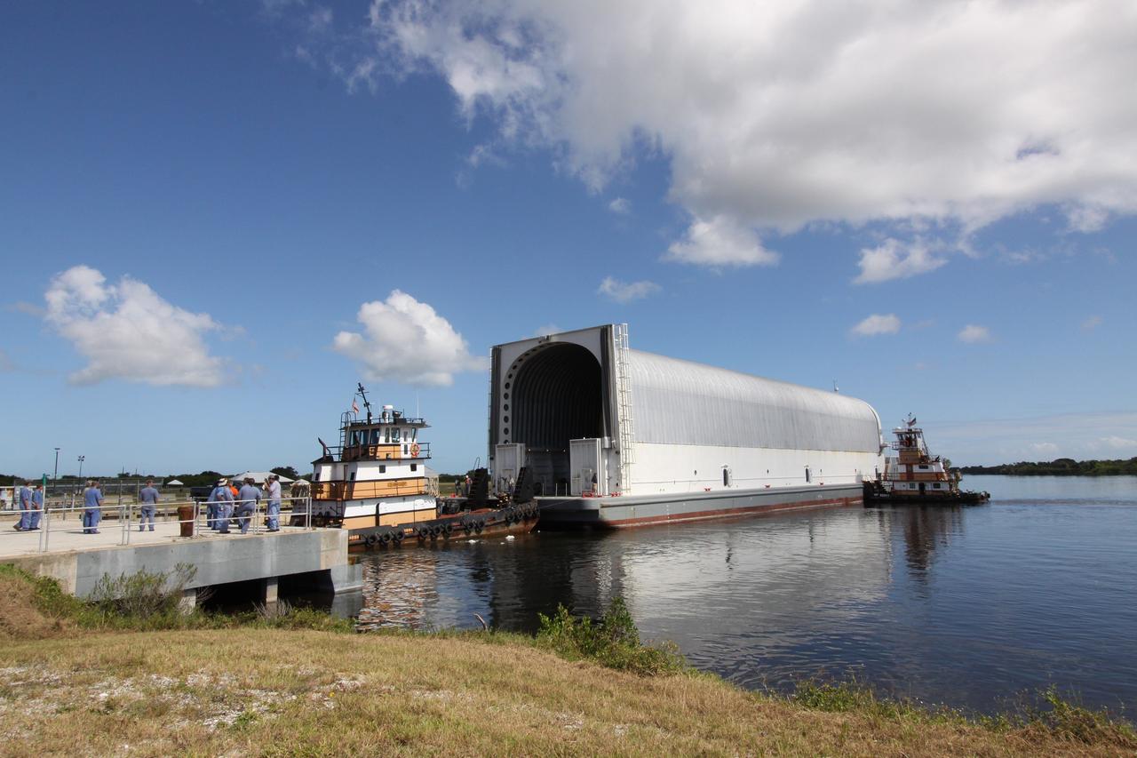 CAPE CANAVERAL, Fla. – Tugboats safely deliver the Pegasus barge, carrying external tank 134, to the dock in the turn basin near the Vehicle Assembly Building, or VAB, at NASA's Kennedy Space Center in Florida. Pegasus arrived in Florida after an ocean voyage towed by a solid rocket booster retrieval ship from NASA's Michoud Assembly Facility near New Orleans. After Pegasus docks in the turn basin, the fuel tank will be offloaded and transported into the VAB. ET-134 will be used to launch space shuttle Endeavour on the STS-130 mission to the International Space Station. Launch is targeted for Feb. 4, 2010. For information on the components of the space shuttle and the STS-130 mission, visit http://www.nasa.gov/shuttle. Photo credit: NASA/Jack Pfaller