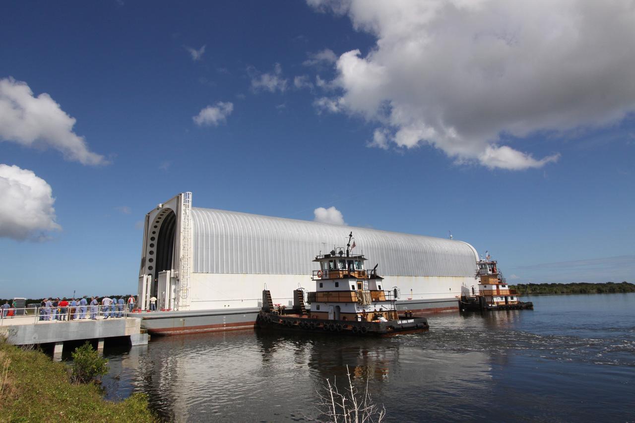 CAPE CANAVERAL, Fla. – Tugboats safely deliver the Pegasus barge, carrying external tank 134, to the dock in the turn basin near the Vehicle Assembly Building, or VAB, at NASA's Kennedy Space Center in Florida. Pegasus arrived in Florida after an ocean voyage towed by a solid rocket booster retrieval ship from NASA's Michoud Assembly Facility near New Orleans. After Pegasus docks in the turn basin, the fuel tank will be offloaded and transported into the VAB. ET-134 will be used to launch space shuttle Endeavour on the STS-130 mission to the International Space Station. Launch is targeted for Feb. 4, 2010. For information on the components of the space shuttle and the STS-130 mission, visit http://www.nasa.gov/shuttle. Photo credit: NASA/Jack Pfaller