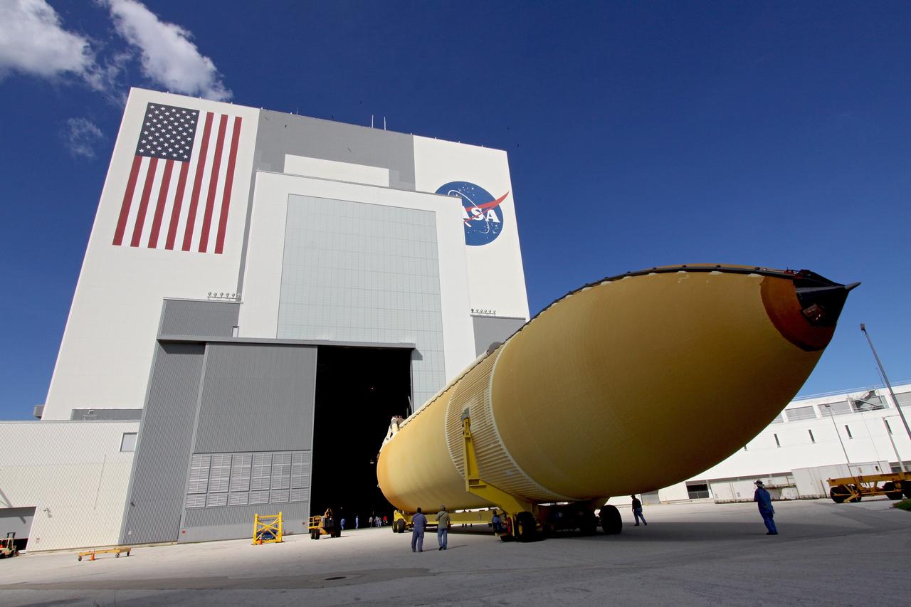 CAPE CANAVERAL, Fla. – External tank 134 is towed toward the open door of the transfer aisle of the Vehicle Assembly Building, or VAB, at NASA's Kennedy Space Center in Florida. The Pegasus barge, carrying the fuel tank, arrived in Florida after an ocean voyage towed by a solid rocket booster retrieval ship from NASA's Michoud Assembly Facility near New Orleans. Next, the tank will be transported into the VAB where it will be stored until needed. ET-134 will be used to launch space shuttle Endeavour on the STS-130 mission to the International Space Station. Launch is targeted for Feb. 4, 2010. For information on the components of the space shuttle and the STS-130 mission, visit http://www.nasa.gov/shuttle. Photo credit: NASA/Jack Pfaller