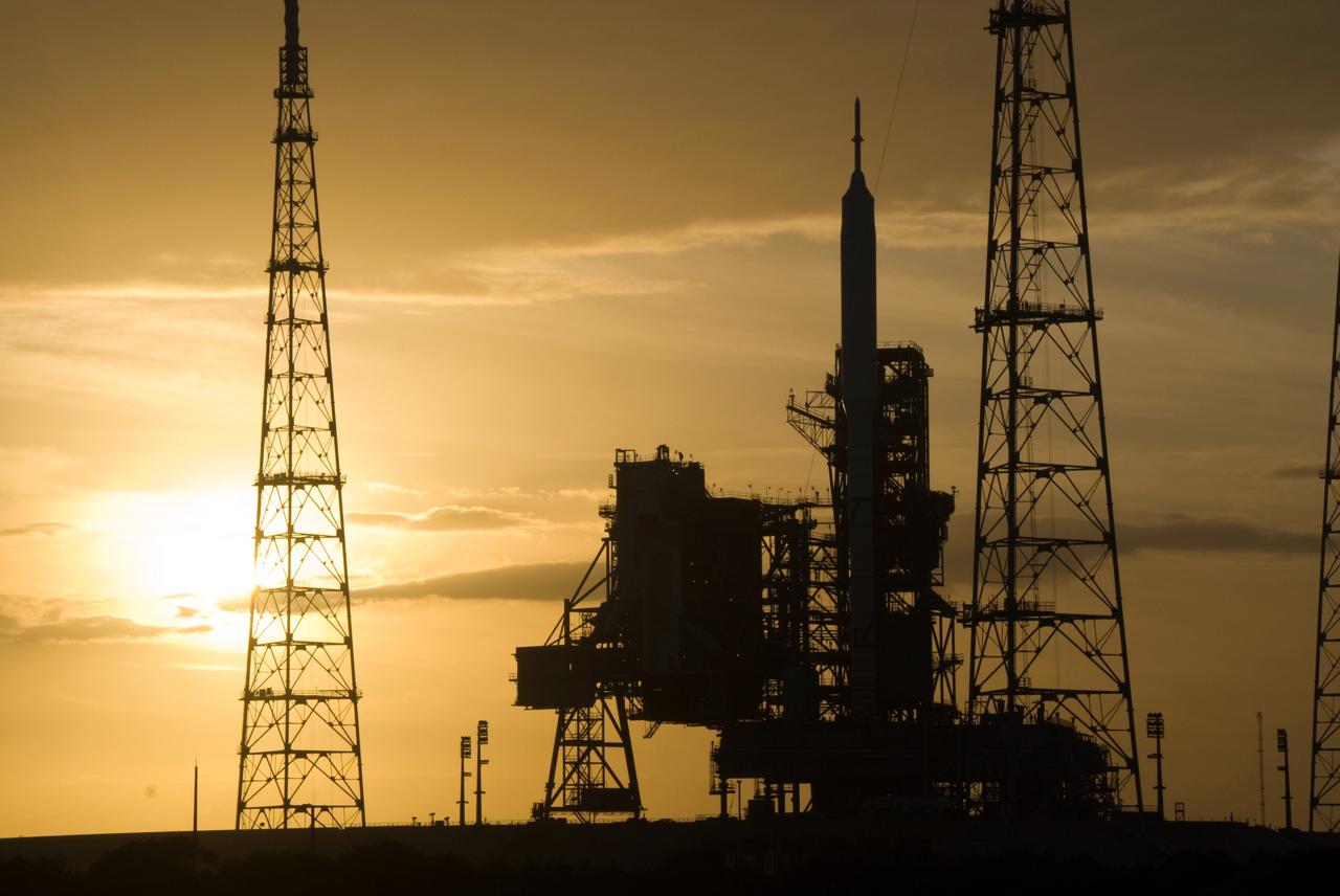 CAPE CANAVERAL, Fla. - As the sun sets behind Launch Complex 39B at NASA's Kennedy Space Center in Florida, the Ares I-X rocket awaits the approaching liftoff of its flight test. This is the first time since the Apollo Program's Saturn rockets were retired that a vehicle other than the space shuttle has occupied the pad. Part of the Constellation Program, the Ares I-X is the test vehicle for the Ares I. The Ares I-X flight test is set for Oct. 27. For information on the Ares I-X vehicle and flight test, visit http://www.nasa.gov/aresIX. Photo credit: NASA/Kim Shiflett