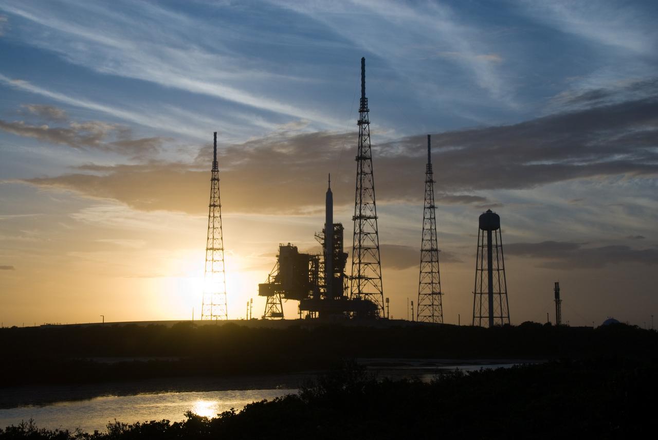 CAPE CANAVERAL, Fla. - Sunset at Launch Pad 39B at NASA's Kennedy Space Center in Florida finds the Ares I-X rocket awaiting the approaching liftoff of its flight test.    This is the first time since the Apollo Program's Saturn rockets were retired that a vehicle other than the space shuttle has occupied the pad.   Part of the Constellation Program, the Ares I-X is the test vehicle for the Ares I.  The Ares I-X flight test is set for Oct. 27.  For information on the Ares I-X vehicle and flight test, visit http://www.nasa.gov/aresIX. Photo credit: NASA/Kim Shiflett