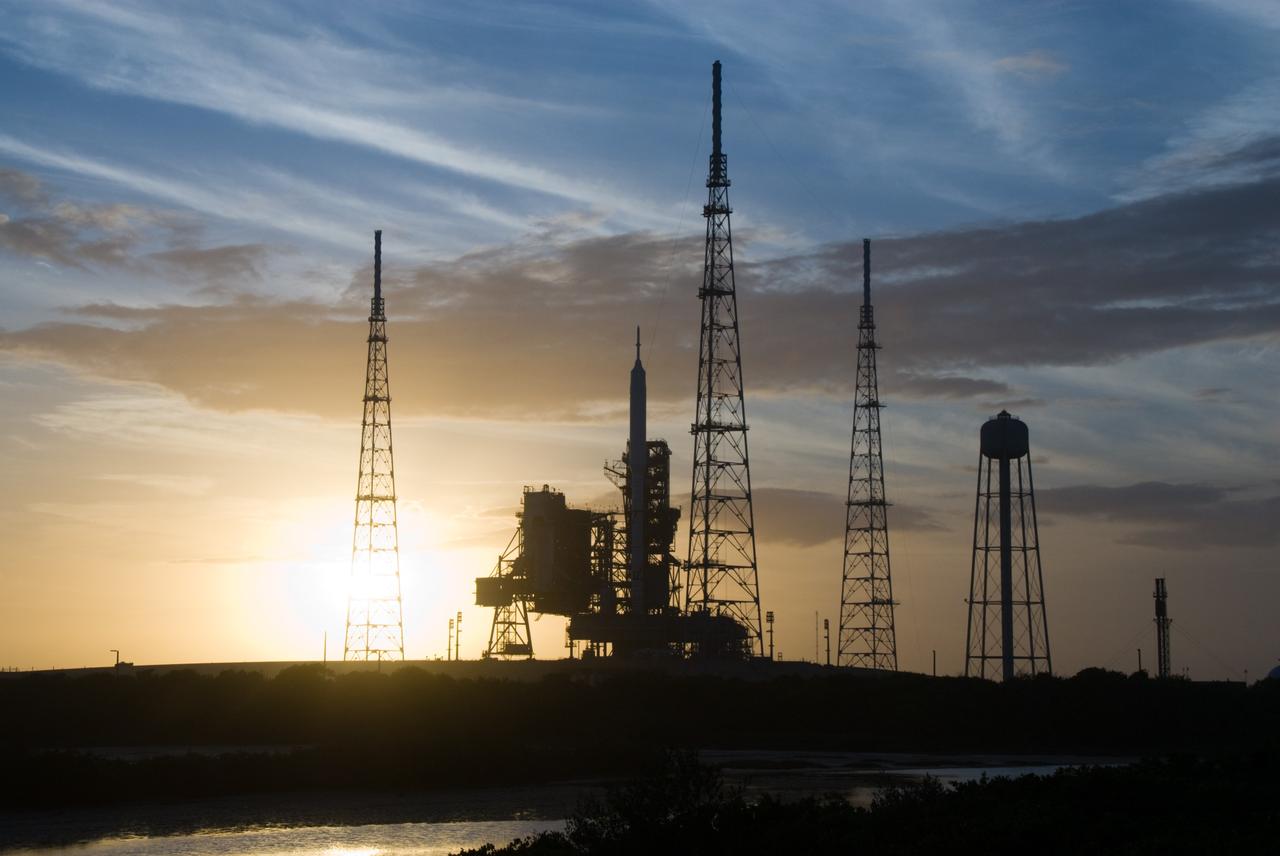 CAPE CANAVERAL, Fla. - Sunset at Launch Pad 39B at NASA's Kennedy Space Center in Florida finds the Ares I-X rocket awaiting the approaching liftoff of its flight test.    This is the first time since the Apollo Program's Saturn rockets were retired that a vehicle other than the space shuttle has occupied the pad.   Part of the Constellation Program, the Ares I-X is the test vehicle for the Ares I.  The Ares I-X flight test is set for Oct. 27.  For information on the Ares I-X vehicle and flight test, visit http://www.nasa.gov/aresIX. Photo credit: NASA/Kim Shiflett