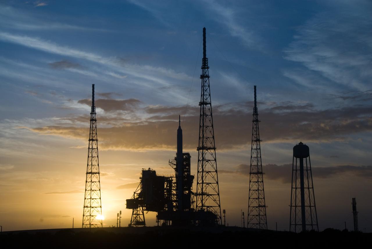 CAPE CANAVERAL, Fla. - Sunset at Launch Pad 39B at NASA's Kennedy Space Center in Florida finds the Ares I-X rocket awaiting the approaching liftoff of its flight test.    This is the first time since the Apollo Program's Saturn rockets were retired that a vehicle other than the space shuttle has occupied the pad.   Part of the Constellation Program, the Ares I-X is the test vehicle for the Ares I.  The Ares I-X flight test is set for Oct. 27.  For information on the Ares I-X vehicle and flight test, visit http://www.nasa.gov/aresIX. Photo credit: NASA/Kim Shiflett