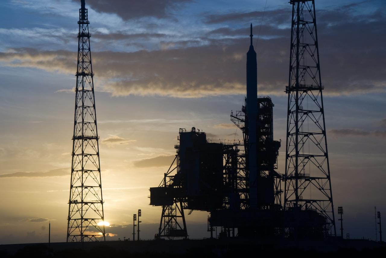 CAPE CANAVERAL, Fla. - Sunset at Launch Pad 39B at NASA's Kennedy Space Center in Florida finds the Ares I-X rocket awaiting the approaching liftoff of its flight test. This is the first time since the Apollo Program's Saturn rockets were retired that a vehicle other than the space shuttle has occupied the pad. Part of the Constellation Program, the Ares I-X is the test vehicle for the Ares I. The Ares I-X flight test is set for Oct. 27. For information on the Ares I-X vehicle and flight test, visit http://www.nasa.gov/aresIX. Photo credit: NASA/Kim Shiflett