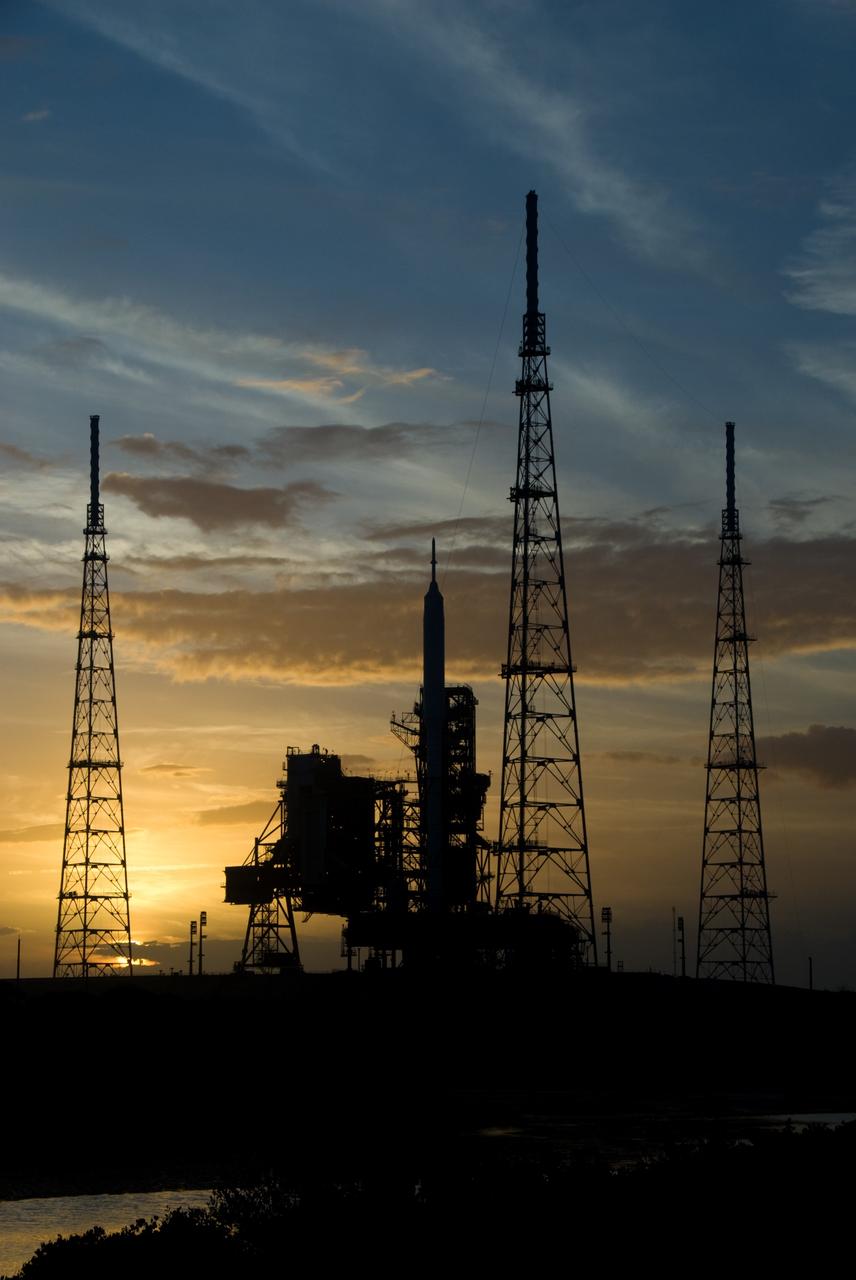 CAPE CANAVERAL, Fla. - Sunset at Launch Pad 39B at NASA's Kennedy Space Center in Florida finds the Ares I-X rocket awaiting the approaching liftoff of its flight test. This is the first time since the Apollo Program's Saturn rockets were retired that a vehicle other than the space shuttle has occupied the pad. Part of the Constellation Program, the Ares I-X is the test vehicle for the Ares I. The Ares I-X flight test is set for Oct. 27. For information on the Ares I-X vehicle and flight test, visit http://www.nasa.gov/aresIX. Photo credit: NASA/Kim Shiflett