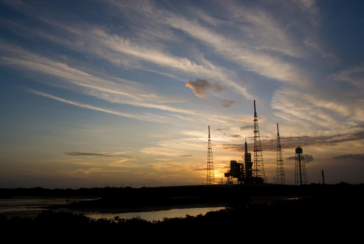 CAPE CANAVERAL, Fla. - Sunset at Launch Pad 39B at NASA's Kennedy Space Center in Florida finds the Ares I-X rocket awaiting the approaching liftoff of its flight test.    This is the first time since the Apollo Program's Saturn rockets were retired that a vehicle other than the space shuttle has occupied the pad.   Part of the Constellation Program, the Ares I-X is the test vehicle for the Ares I.  The Ares I-X flight test is set for Oct. 27.  For information on the Ares I-X vehicle and flight test, visit http://www.nasa.gov/aresIX. Photo credit: NASA/Kim Shiflett