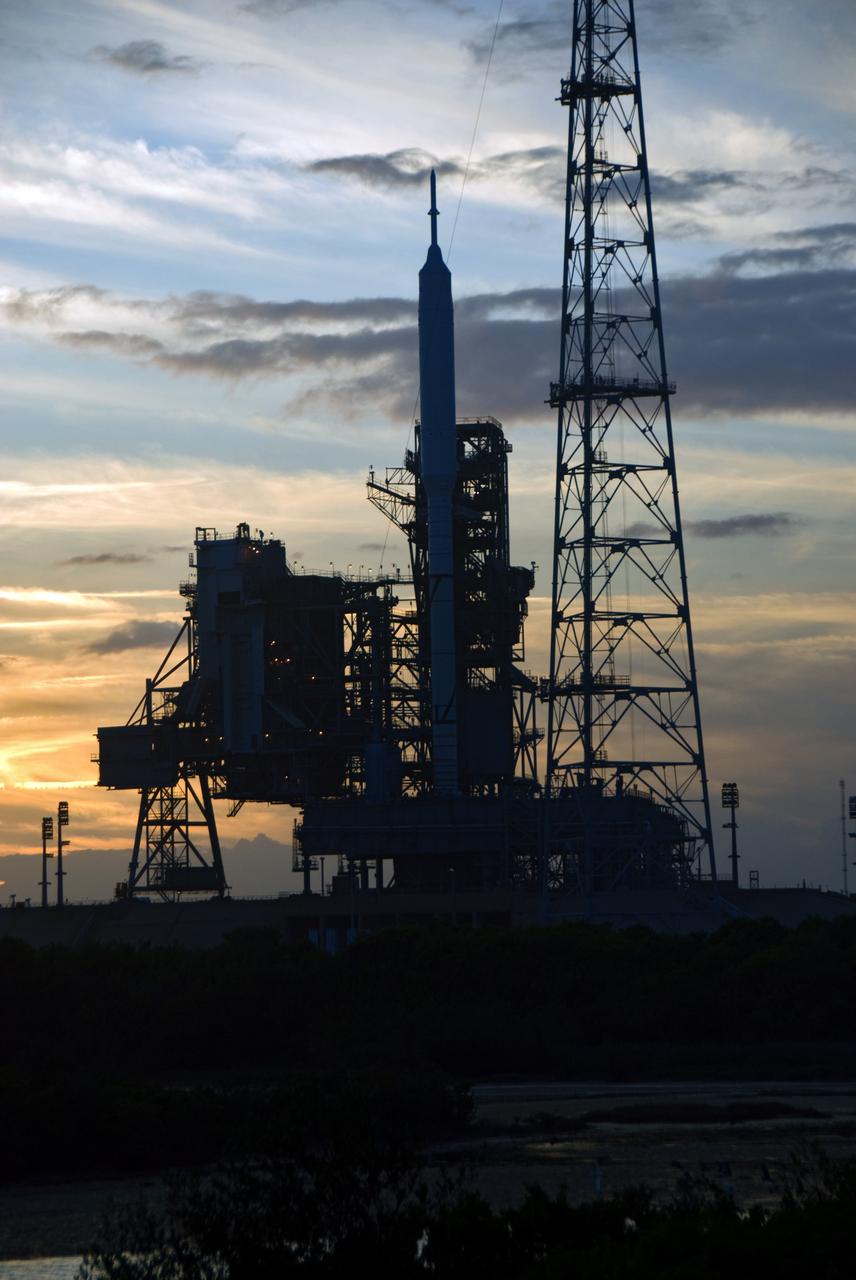 CAPE CANAVERAL, Fla. - Sunset at Launch Pad 39B at NASA's Kennedy Space Center in Florida finds the Ares I-X rocket awaiting the approaching liftoff of its flight test. This is the first time since the Apollo Program's Saturn rockets were retired that a vehicle other than the space shuttle has occupied the pad. Part of the Constellation Program, the Ares I-X is the test vehicle for the Ares I. The Ares I-X flight test is set for Oct. 27. For information on the Ares I-X vehicle and flight test, visit http://www.nasa.gov/aresIX. Photo credit: NASA/Kim Shiflett