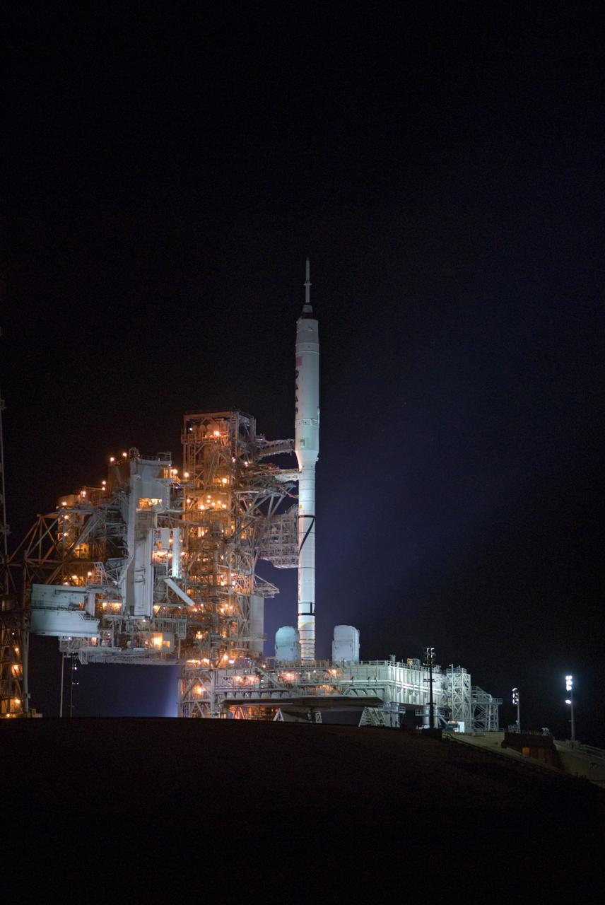 CAPE CANAVERAL, Fla. - As nightfall comes to Launch Complex 39B at NASA's Kennedy Space Center in Florida, xenon lights illuminate the pad and the Ares I-X rocket awaiting the approaching liftoff of its flight test.    This is the first time since the Apollo Program's Saturn rockets were retired that a vehicle other than the space shuttle has occupied the pad.   Part of the Constellation Program, the Ares I-X is the test vehicle for the Ares I.  The Ares I-X flight test is set for Oct. 27.  For information on the Ares I-X vehicle and flight test, visit http://www.nasa.gov/aresIX. Photo credit: NASA/Kim Shiflett