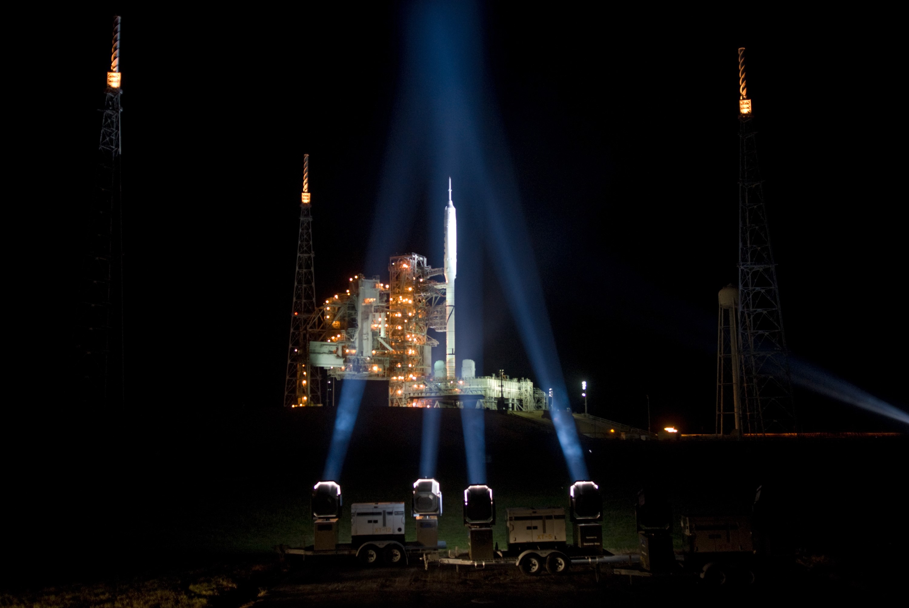 CAPE CANAVERAL, Fla. - As nightfall comes to Launch Complex 39B at NASA's Kennedy Space Center in Florida, xenon lights reveal the Ares I-X rocket awaiting the approaching liftoff of its flight test. This is the first time since the Apollo Program's Saturn rockets were retired that a vehicle other than the space shuttle has occupied the pad. Part of the Constellation Program, the Ares I-X is the test vehicle for the Ares I. The Ares I-X flight test is set for Oct. 27. For information on the Ares I-X vehicle and flight test, visit http://www.nasa.gov/aresIX. Photo credit: NASA/Kim Shiflett