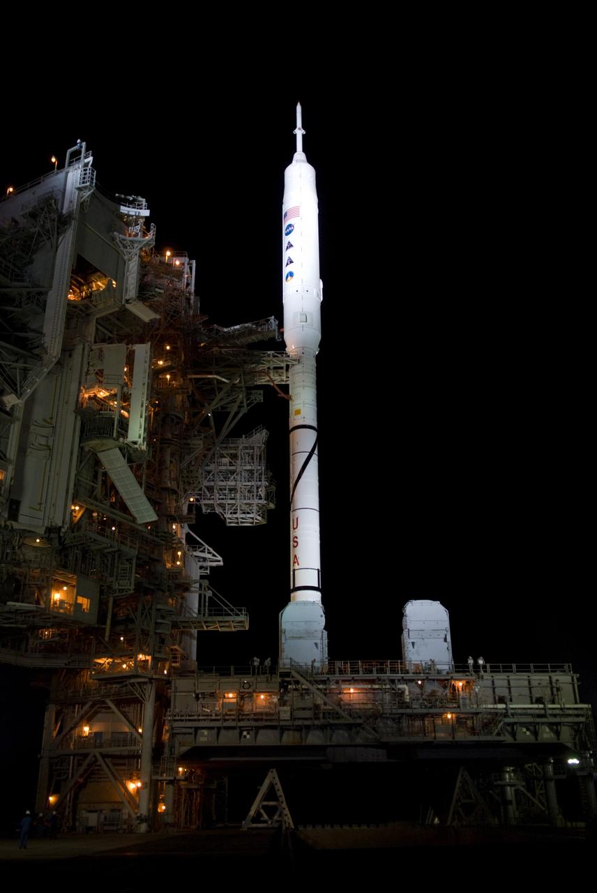 CAPE CANAVERAL, Fla. - As nightfall comes to Launch Complex 39B at NASA's Kennedy Space Center in Florida, xenon lights reveal the Ares I-X rocket awaiting the approaching liftoff of its flight test.    This is the first time since the Apollo Program's Saturn rockets were retired that a vehicle other than the space shuttle has occupied the pad.   Part of the Constellation Program, the Ares I-X is the test vehicle for the Ares I.  The Ares I-X flight test is set for Oct. 27.  For information on the Ares I-X vehicle and flight test, visit http://www.nasa.gov/aresIX. Photo credit: NASA/Kim Shiflett