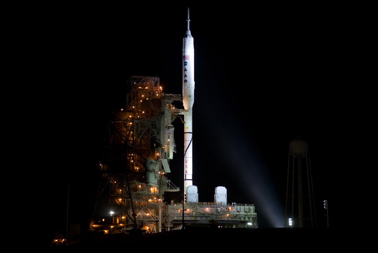 CAPE CANAVERAL, Fla. - As night settles over Launch Complex 39B at NASA's Kennedy Space Center in Florida, xenon lights reveal the Ares I-X rocket awaiting the approaching liftoff of its flight test. This is the first time since the Apollo Program's Saturn rockets were retired that a vehicle other than the space shuttle has occupied the pad. Part of the Constellation Program, the Ares I-X is the test vehicle for the Ares I. The Ares I-X flight test is set for Oct. 27. For information on the Ares I-X vehicle and flight test, visit http://www.nasa.gov/aresIX. Photo credit: NASA/Kim Shiflett