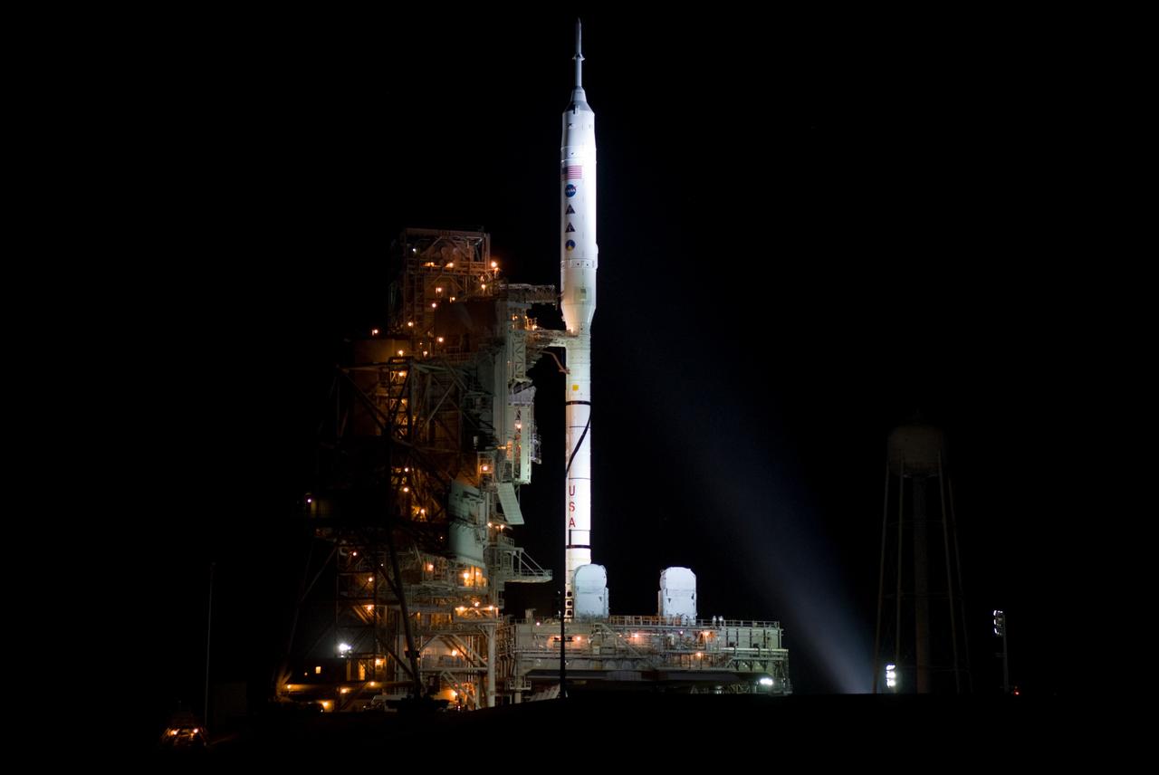 CAPE CANAVERAL, Fla. - As night settles over Launch Complex 39B at NASA's Kennedy Space Center in Florida, xenon lights reveal the Ares I-X rocket awaiting the approaching liftoff of its flight test.    This is the first time since the Apollo Program's Saturn rockets were retired that a vehicle other than the space shuttle has occupied the pad.   Part of the Constellation Program, the Ares I-X is the test vehicle for the Ares I.  The Ares I-X flight test is set for Oct. 27.  For information on the Ares I-X vehicle and flight test, visit http://www.nasa.gov/aresIX. Photo credit: NASA/Kim Shiflett