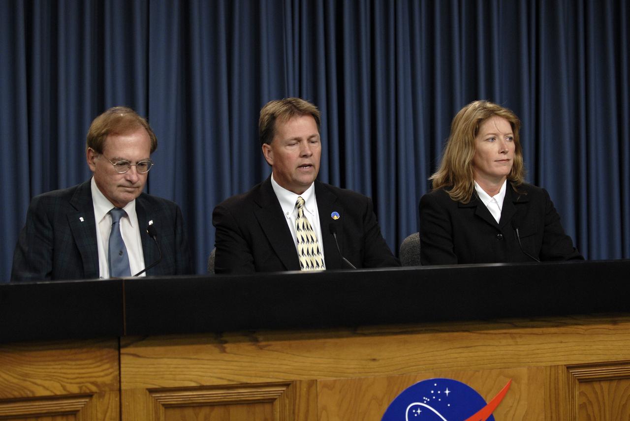 CAPE CANAVERAL, Fla. – At NASA's Kennedy Space Center in Florida, a launch status briefing for the Ares I-X rocket's flight test is held in the Press Site auditorium. From left are moderator George Diller, NASA Public Affairs officer; Jeff Spaulding, NASA test director for Ares I-X; and Kathy Winters, launch weather officer.    The team is not tracking any problems, the rocket is in great shape, and they are ready for liftoff from Launch Pad 39B on Oct. 27 at 8 a.m. EDT.  For information on the Ares I-X vehicle and flight test, visit http://www.nasa.gov/aresIX.  Photo credit: NASA/Kim Shiflett