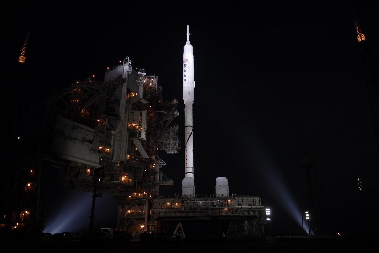 CAPE CANAVERAL, Fla. – At Launch Pad 39B at NASA's Kennedy Space Center in Florida, xenon lights illuminate the Constellation Program's 327-foot-tall Ares I-X rocket after the rotating service structure, has been retracted from around it for launch. The transfer of the pad from the Space Shuttle Program to the Constellation Program took place May 31. Modifications made to the pad include the removal of shuttle unique subsystems, such as the orbiter access arm and a section of the gaseous oxygen vent arm, and the installation of three 600-foot lightning towers, access platforms, environmental control systems and a vehicle stabilization system. The data returned from more than 700 sensors throughout the rocket will be used to refine the design of future launch vehicles and bring NASA one step closer to reaching its exploration goals. The Ares I-X flight test is targeted for Oct. 27. For information on the Ares I-X vehicle and flight test, visit http://www.nasa.gov/aresIX. Photo credit: NASA/Kim Shiflett